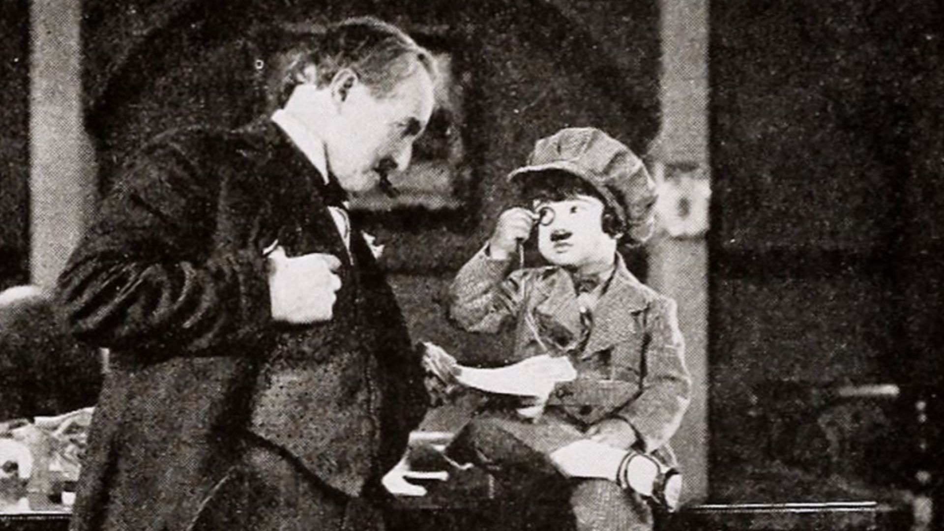 Still from the American comedy short film The Kid Reporter (1923) with an unidentified actor and Diana Serra Cary aka Baby Peggy, on page 404 of the January 20, 1923 Exhibitor's Trade Review.