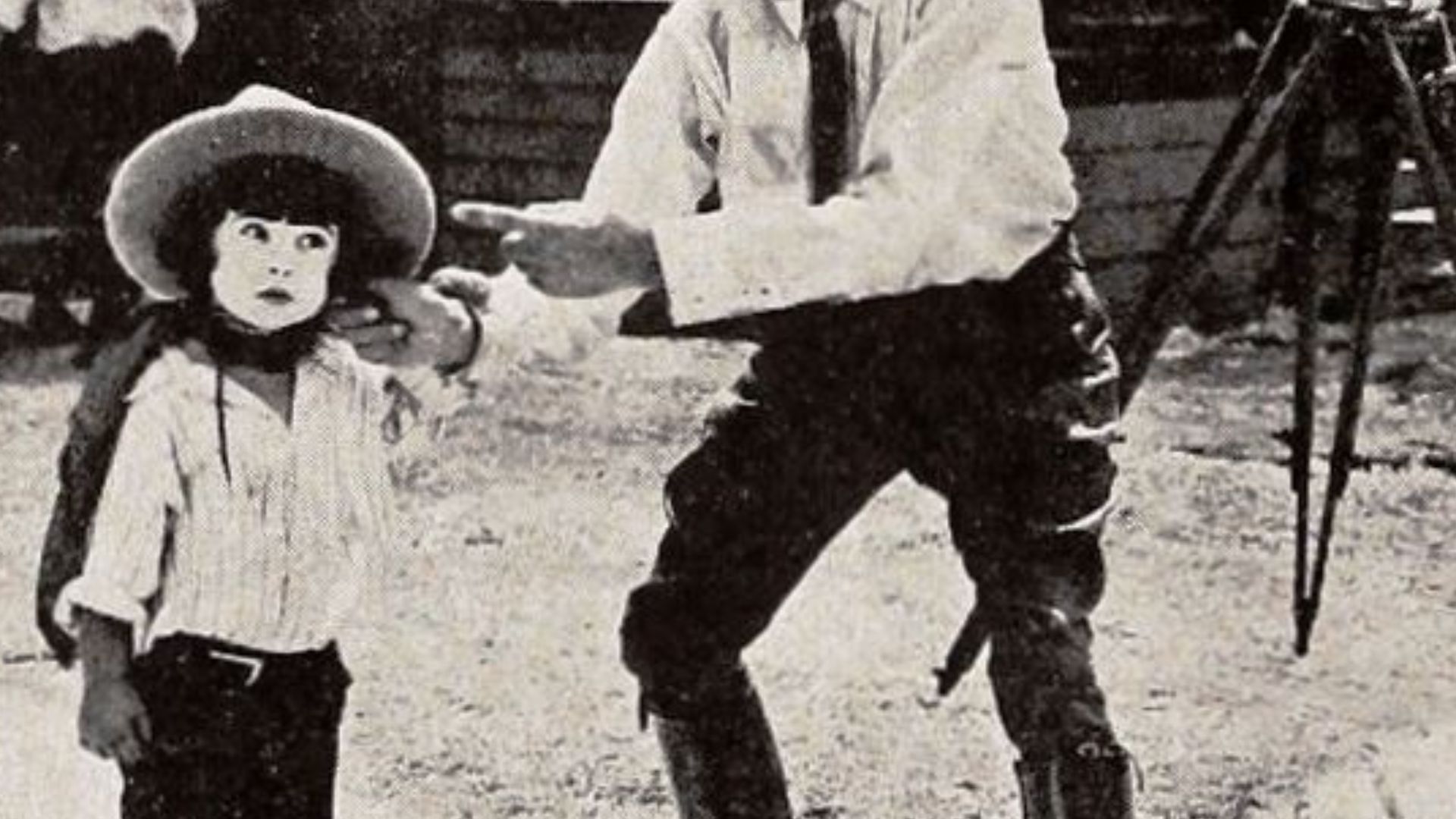 Still from the American comedy short film Peg o' the Movies (1923) with Diana Serra Cary aka Baby Peggy and an unidentified actor, on page 404 of the January 20, 1923 Exhibitor's Trade Review.