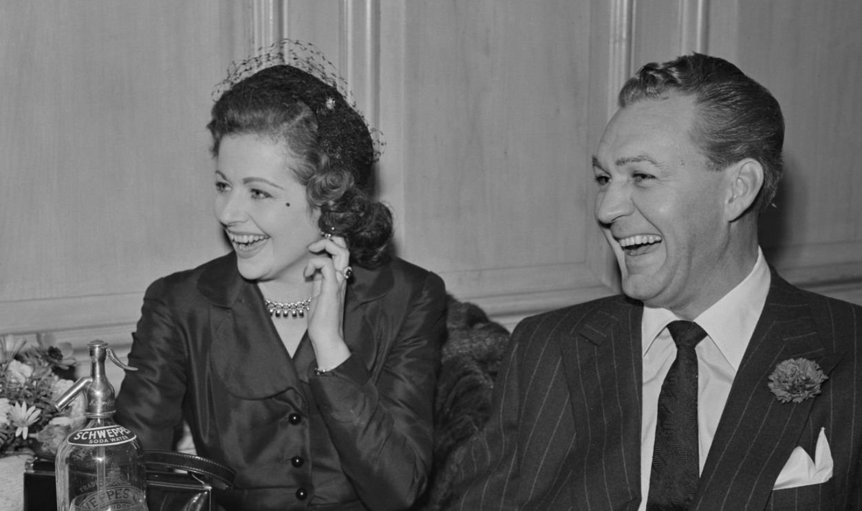 English actress Margaret Lockwood (1916 - 1990) and American actor Forrest Tucker (1919 - 1986), stars of the British film 'Laughing Anne', attending an event, November 10th 1953. 