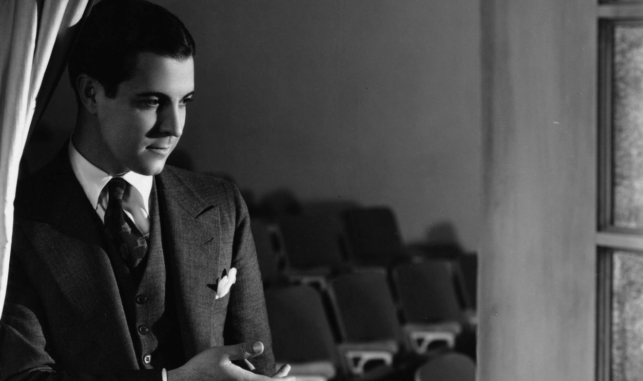 Ramon Novarro (1899 - 1968), Hollywood film star and actor, signed by MGM, directs guests into his own private cinema