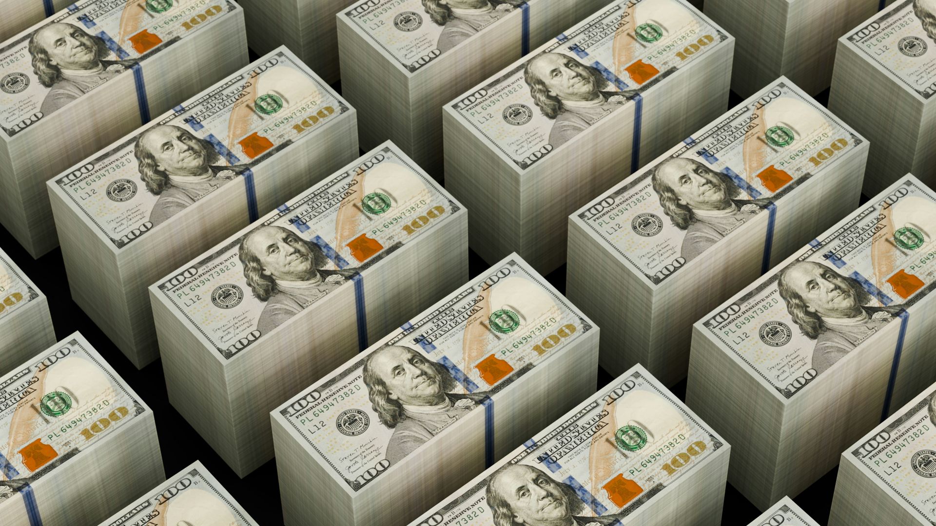 Stacks of hundred dollar bills are shown.