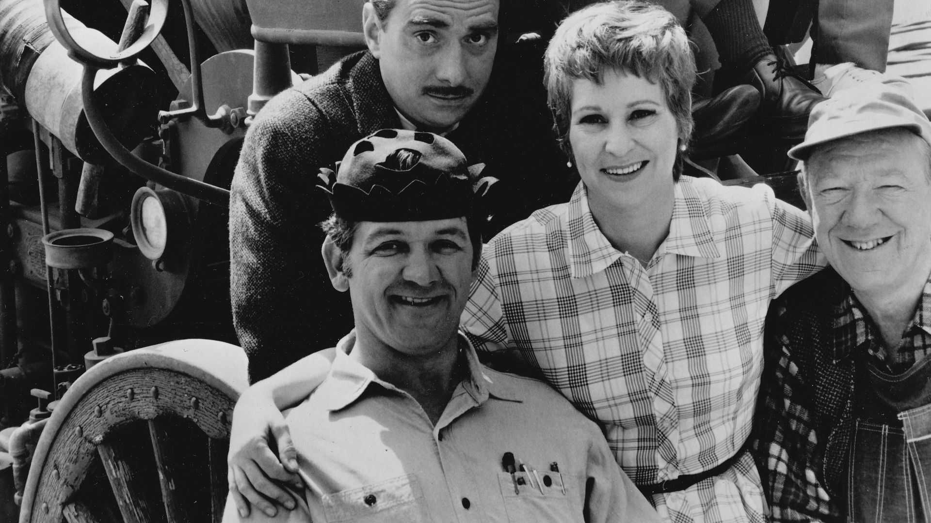 Publicity photo of American actors, (top row; seated in fire engine; L–R) Ken Berry, Arlene Golonka, Buddy Foster, (front row; L–R) George Lindsey (in hat), Jack Dodson, Alice Ghostley and Paul Hartman, promoting the CBS television series Mayberry R.F.D..
