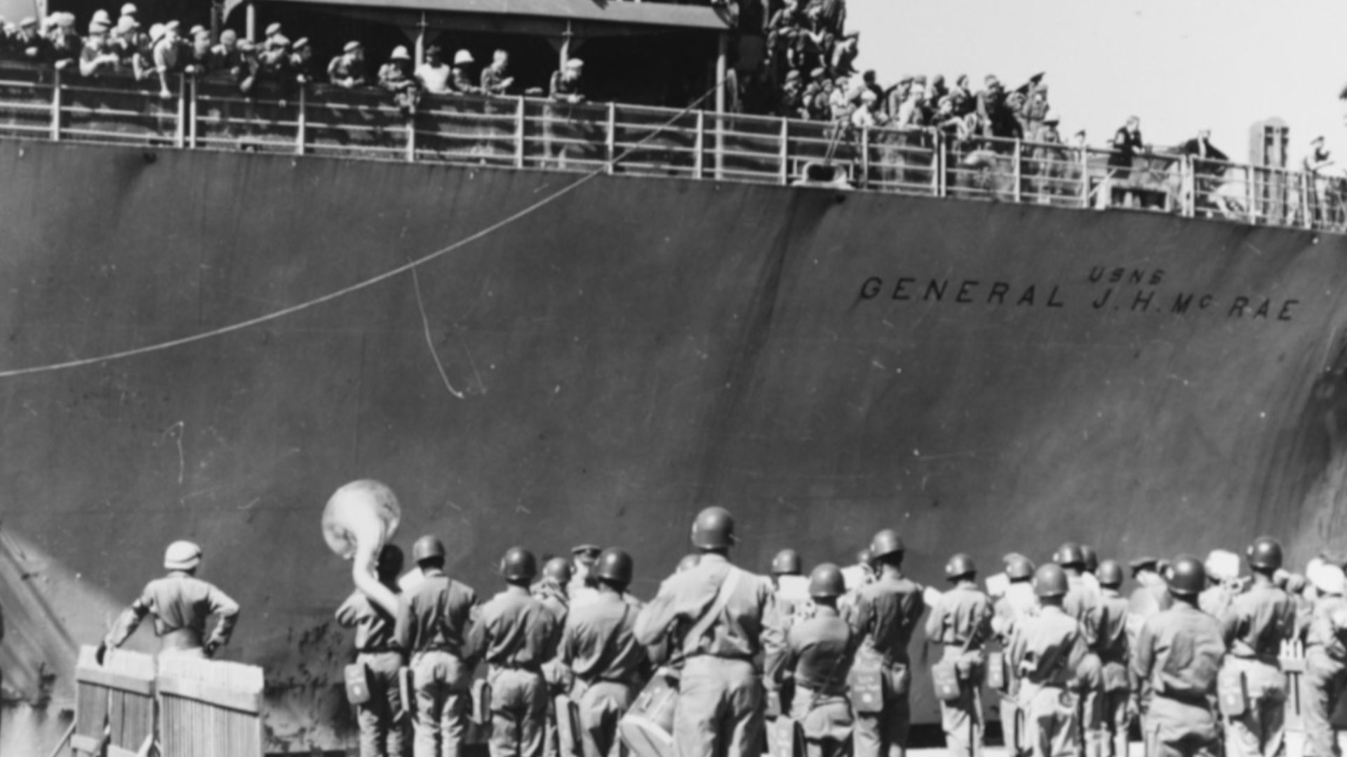 The 56th Army Band plays The Saint Louis Blues to Ethopian, Dutch and Greek troops as they arrive at a Korean port to join the United Nations' Command, 8 May 1951.