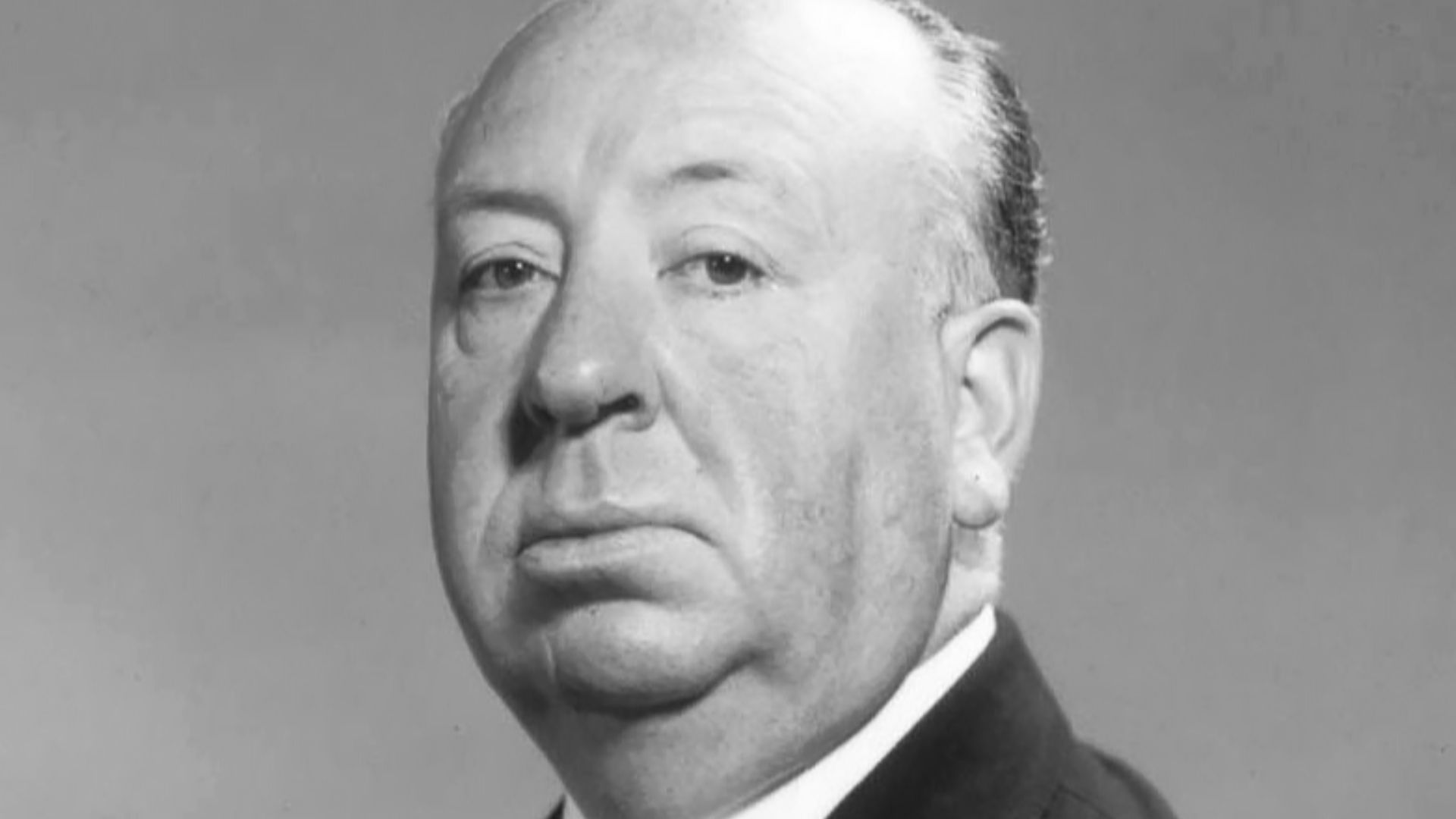 Studio publicity photo of Alfred Hitchcock.
