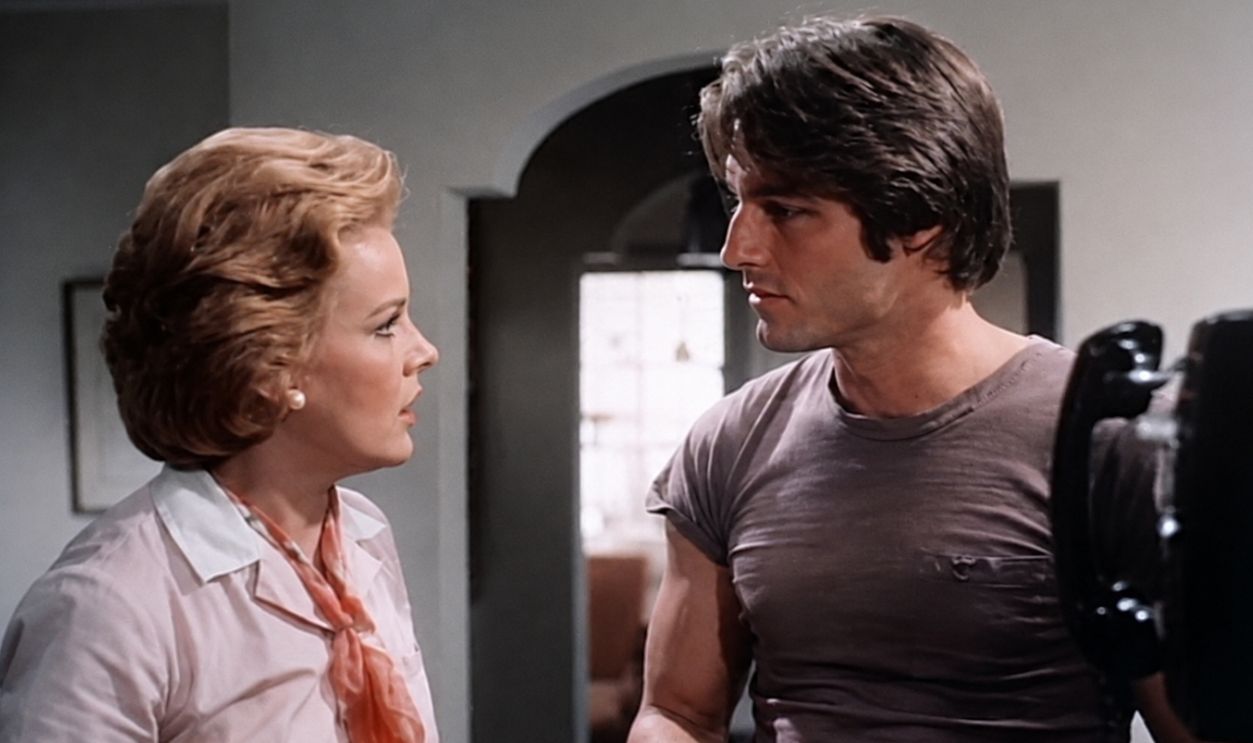 Screenshot from the trailer for the American film Andy Warhol's Bad (1977) with Carroll Baker and Perry King.