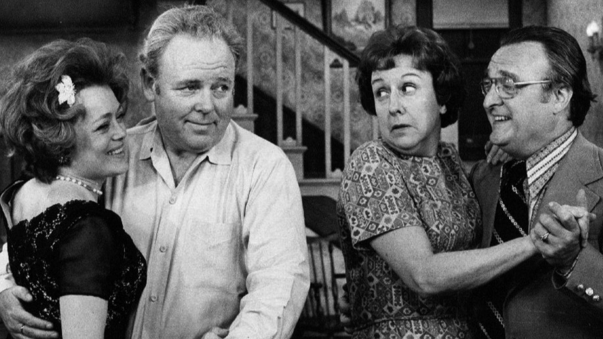 Photo of Rue McClanahan and Vincent Gardenia as Ruth and Curtis Rempley with Carroll O'Connor and Jean Stapleton as Archie and Edith Bunker.  When Edith invites a nice new couple she met to come to the Bunkers for the evening, after switching dancing part
