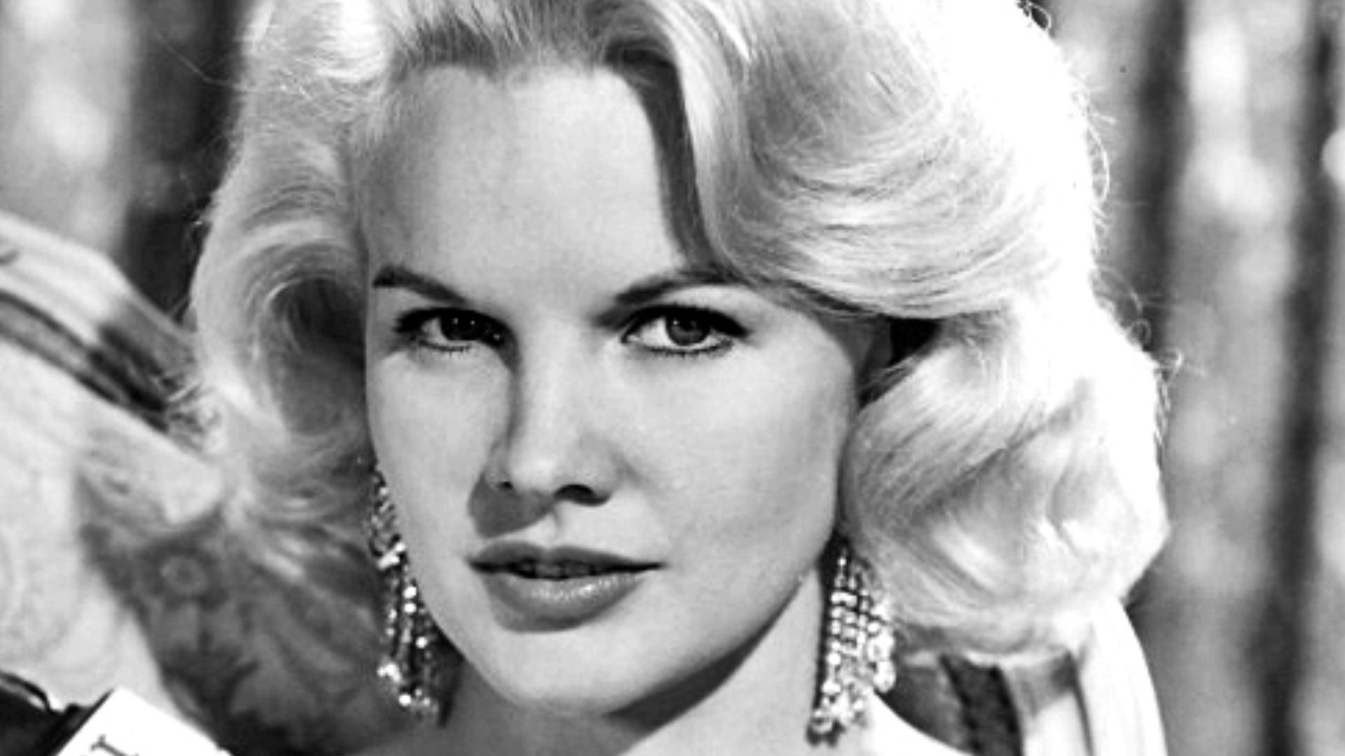 Publicity photo of Carroll Baker for film Harlow (1965). See also film still. No copyright notice shown on original photo.