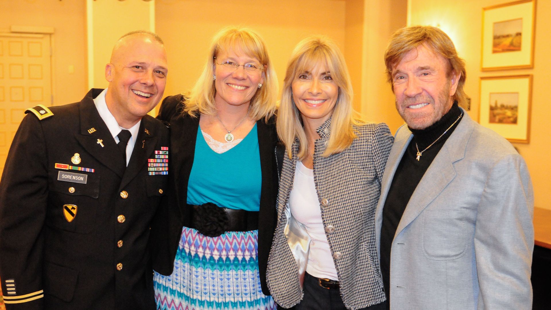 Chuck Norris, right, and his wife, Gena, pose with Chaplain Lt. Col. Kenneth R. Sorenson, left, Division West command chaplain, and his wife, Patrice, after the Texas State Prayer Breakfast in Austin, Texas, Monday. Norris was the guest speaker for the da