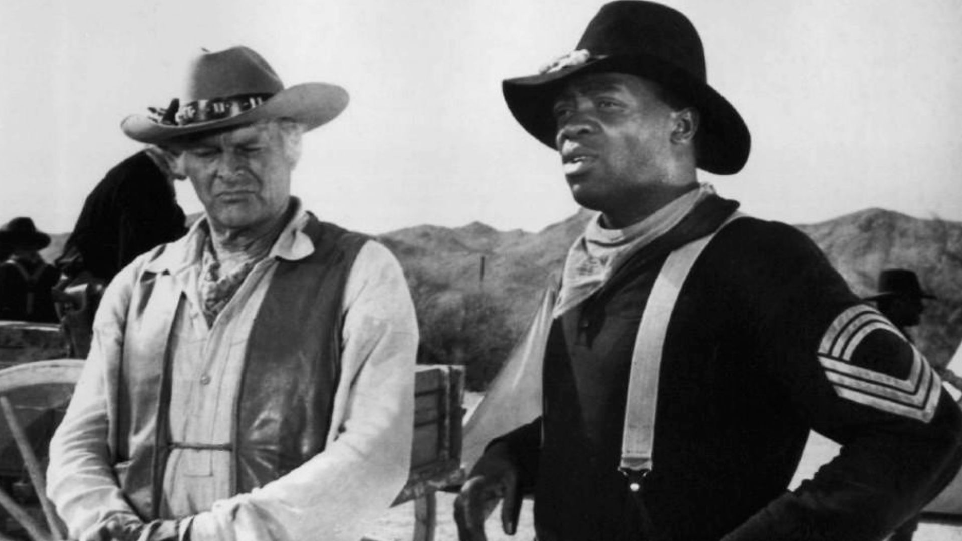Photo of Leif Erickson as John Cannon and Yaphet Kotto as the leader of an all African-American group of cavalry soldiers from the television program The High Chaparral.