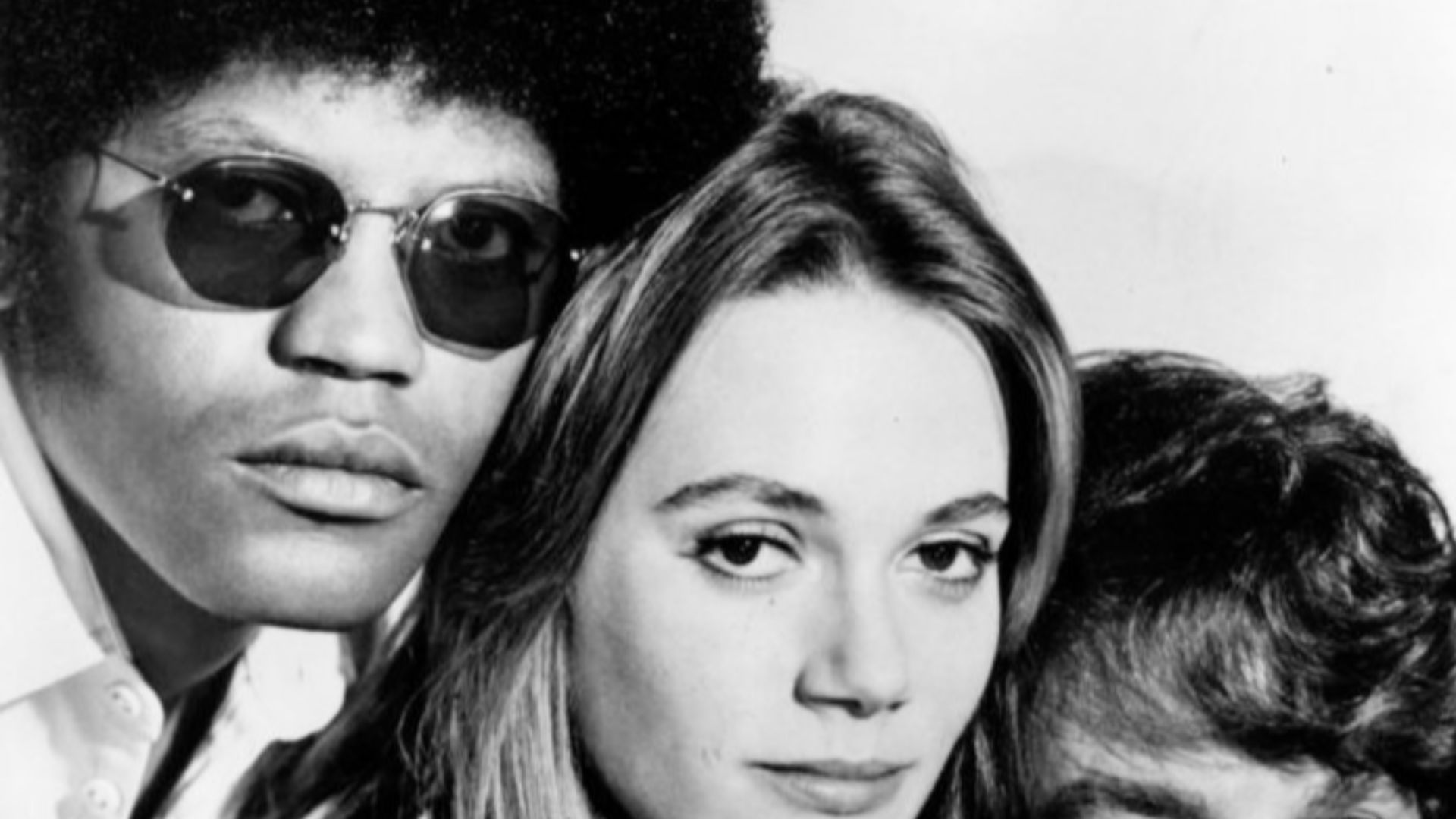 Publicity photo from the television program The Mod Squad.  The main cast is pictured, from left: Clarence Williams III, Peggy Lipton, Michael Cole.