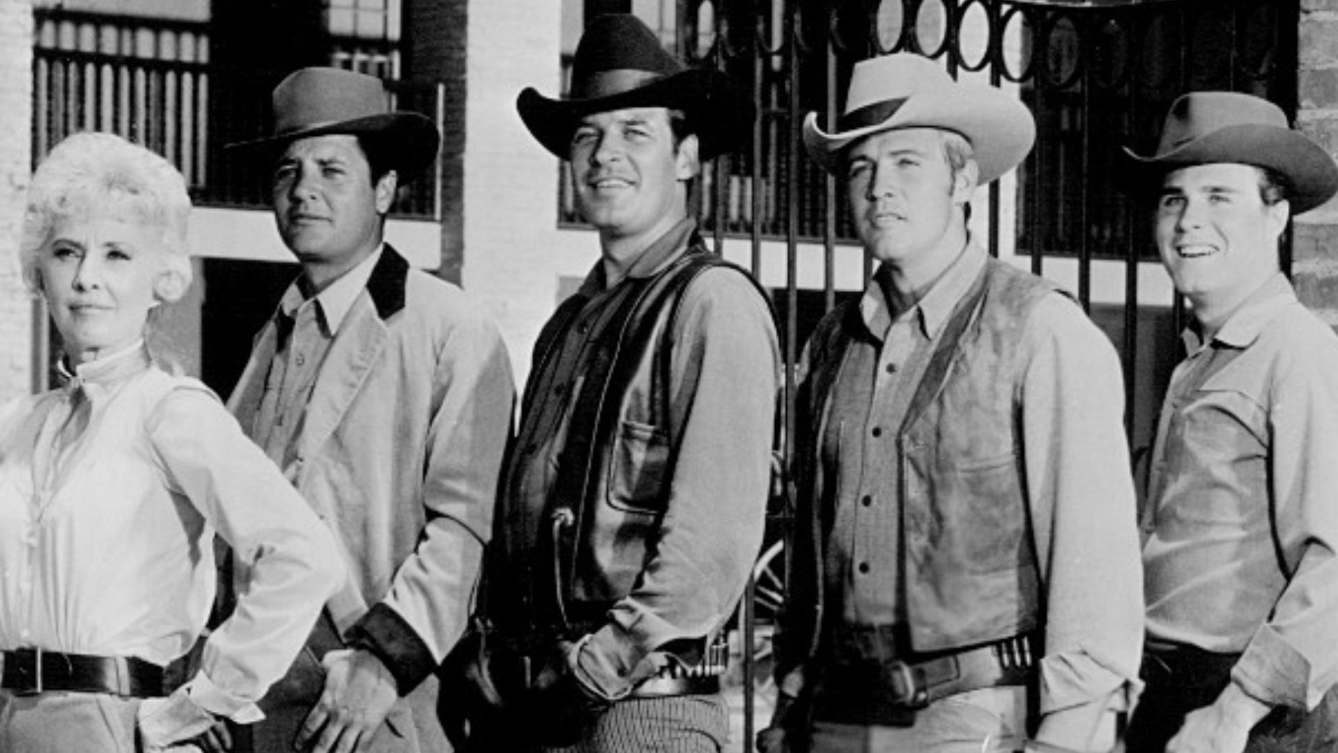 Photo of the cast of the television Western The Big Valley. From left: Linda Evans (Audra), Barbara Stanwyck (Victoria), Richard Long (Jarrod), Peter Breck (Nick), Lee Majors (Heath) and Charles Briles (Eugene).