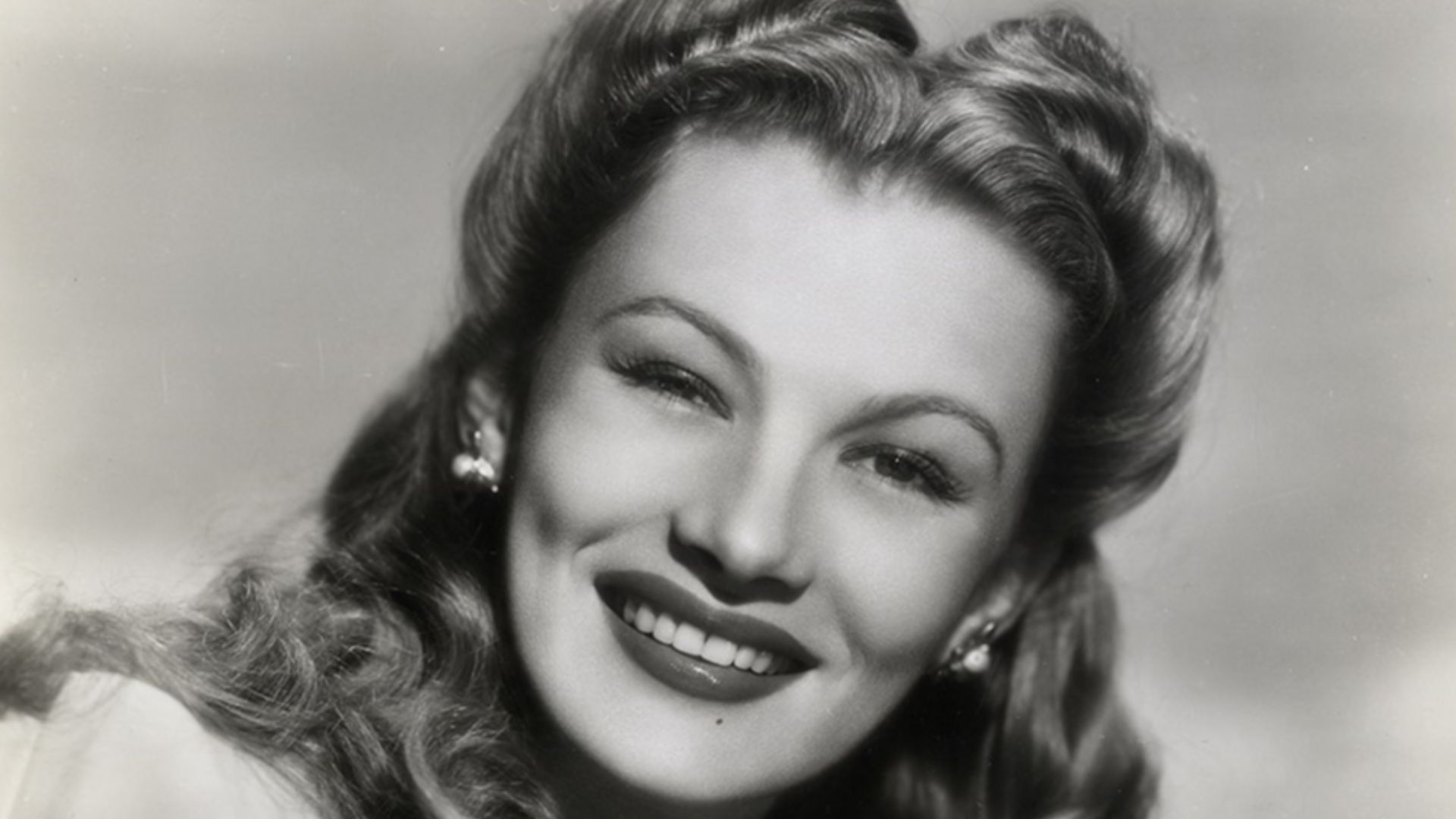 American Actress Veronica Lake
Squib from reverse side of print: ACCENT ON GLAMOUR — The striking beauty of blonde Veronica Lake has been apparent ever since she debuted in movies as a girl with hair over one eye. Gone is the Peek-a-boo Bang, but the glam