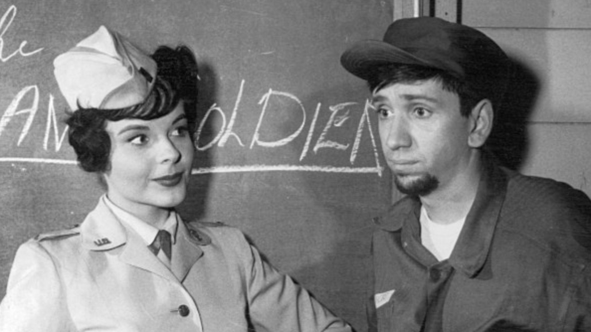 Photo of Bob Denver as Maynard G. Krebs and Kaye Elhardt from the comedy television series The Many Loves of Dobie Gillis.  Maynard was not prepared to lose his beard when he joined the Army.