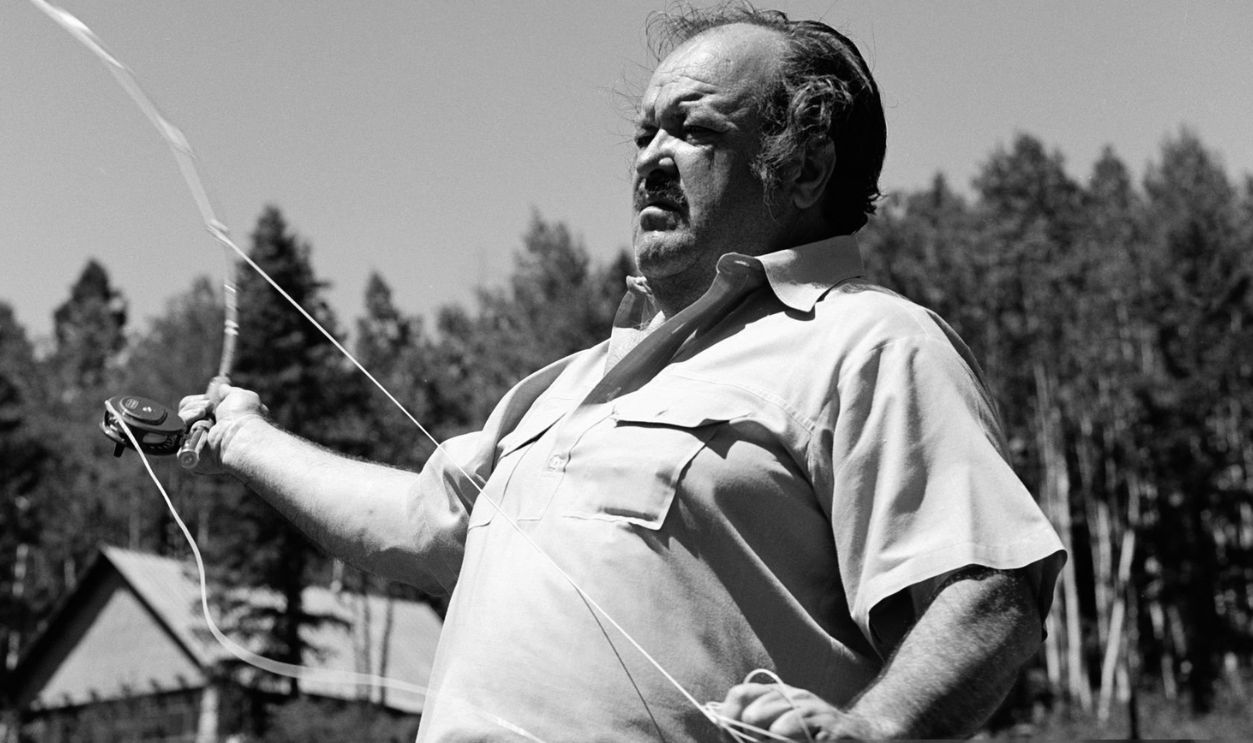 American actor William Conrad (1920 - 1994) casts a line with a fishing rod in a scene from an episode of the television drama 'Cannon' entitled 'Sky Above, Death Below,' California, July 28, 1972. The episode was originally broadcast on September 20, 1972.