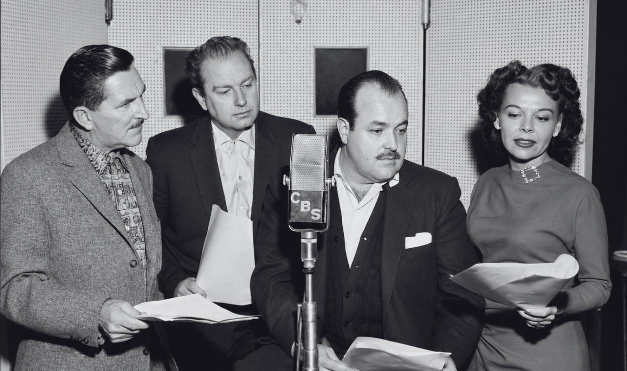 LOS ANGELES - JANUARY 19: CBS Radio western drama, Gunsmoke. Los Angeles, CA. Lead cast members, left to right, Howard McNear (as Doc Charles Adams), Parley Baer (as deputy Chester Wesley Proudfoot), William Conrad (as U.S. Marshall Matt Dillon), and Georgia Ellis (as Miss Kitty Russell). January 19, 1957. 