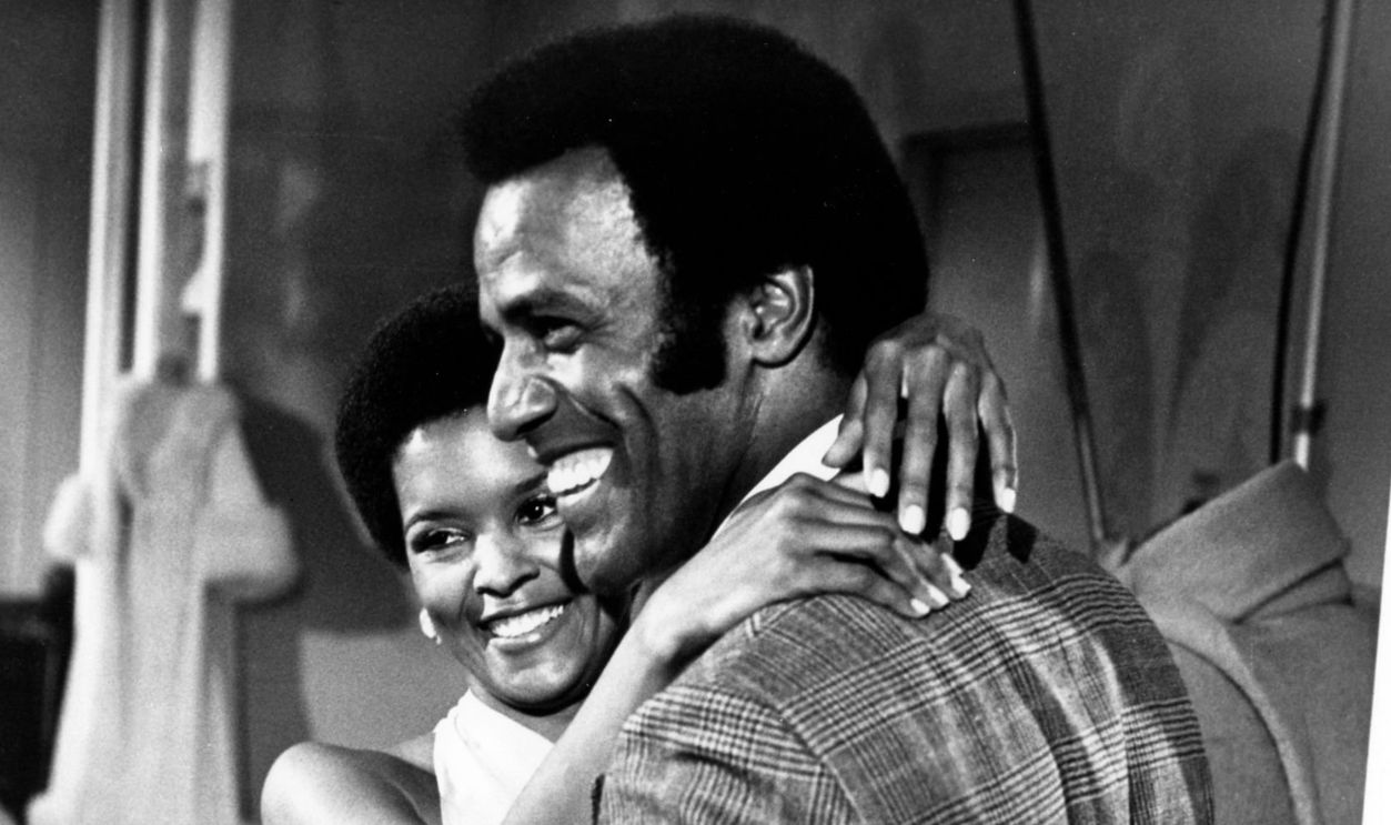 Fred Williamson, a public relations executive smiles as he gets close to Jeannie Bell as his girlfriend in a scene from the movie