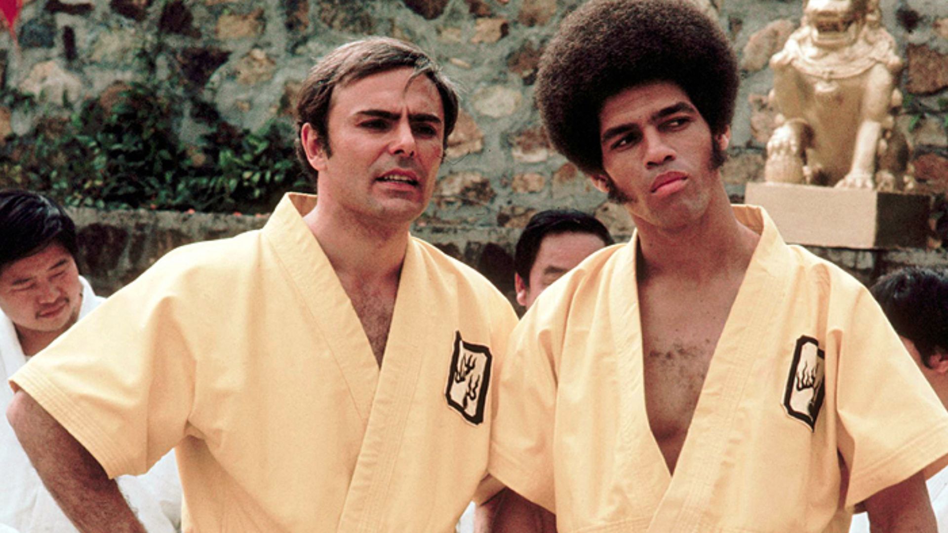 This 1973 photo released by Warner Bros. Entertainment shows John Saxon as Roper, left, and Jim Kelly as Williams in a scene from