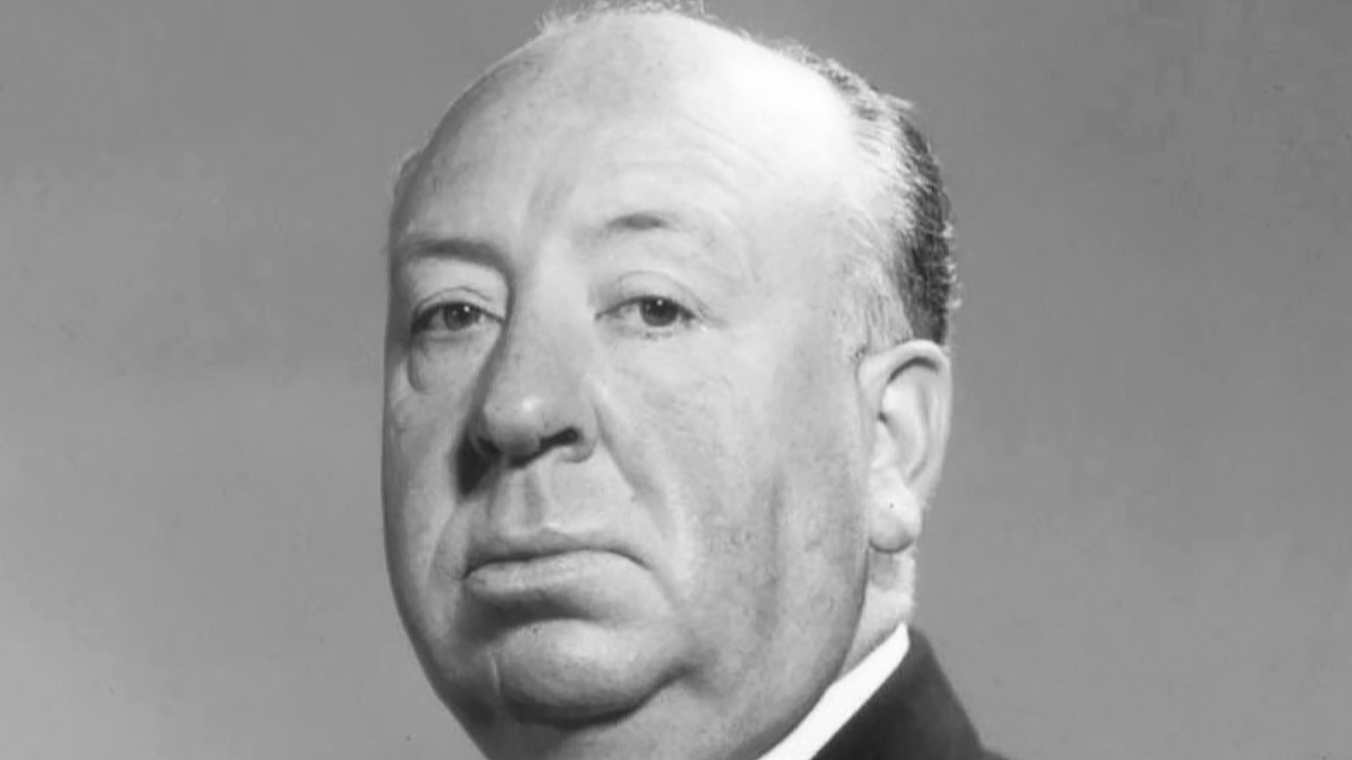 Studio publicity photo of Alfred Hitchcock.