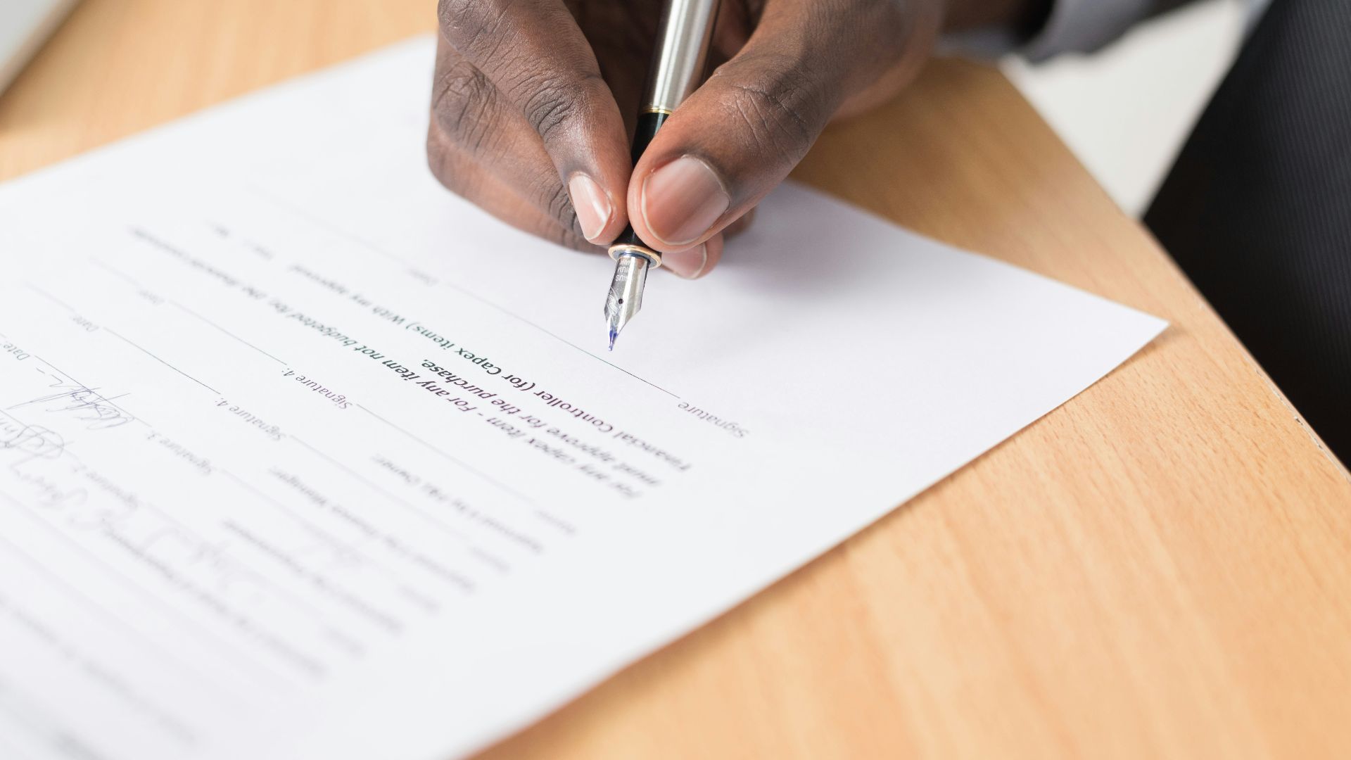 person writing on white paper