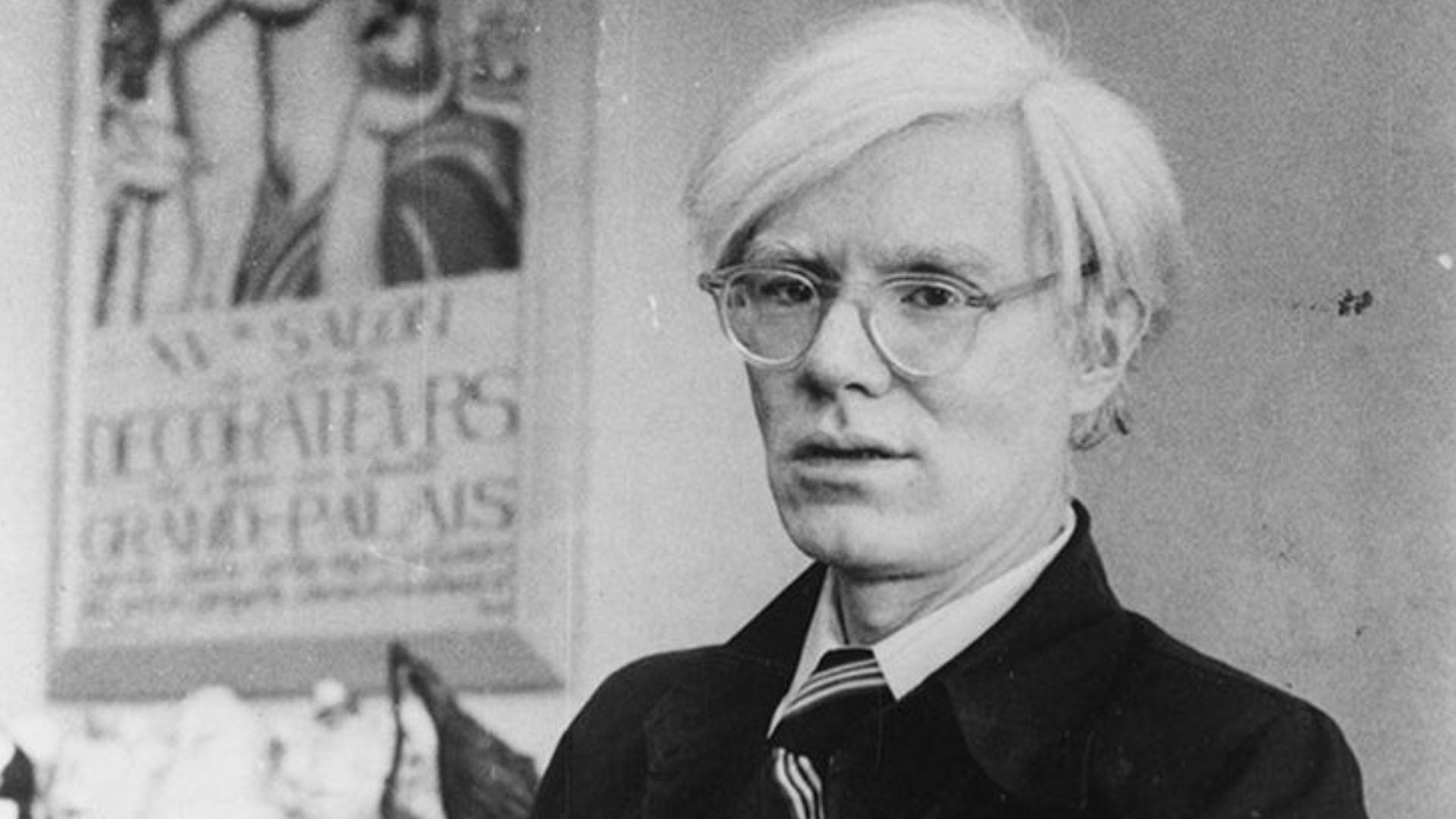 Andy Warhol and his dachshund Archie at his New York studio, the Factory