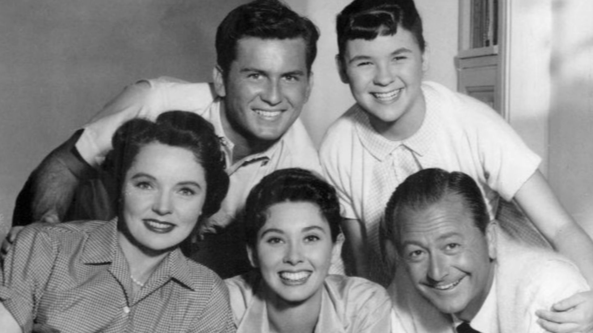 Photo of the cast of the television program Father Knows Best. Top, from left: Billy Gray, Lauren Chapin. Bottom, from left: Jane Wyatt, Elinor Donahue, Robert Young.