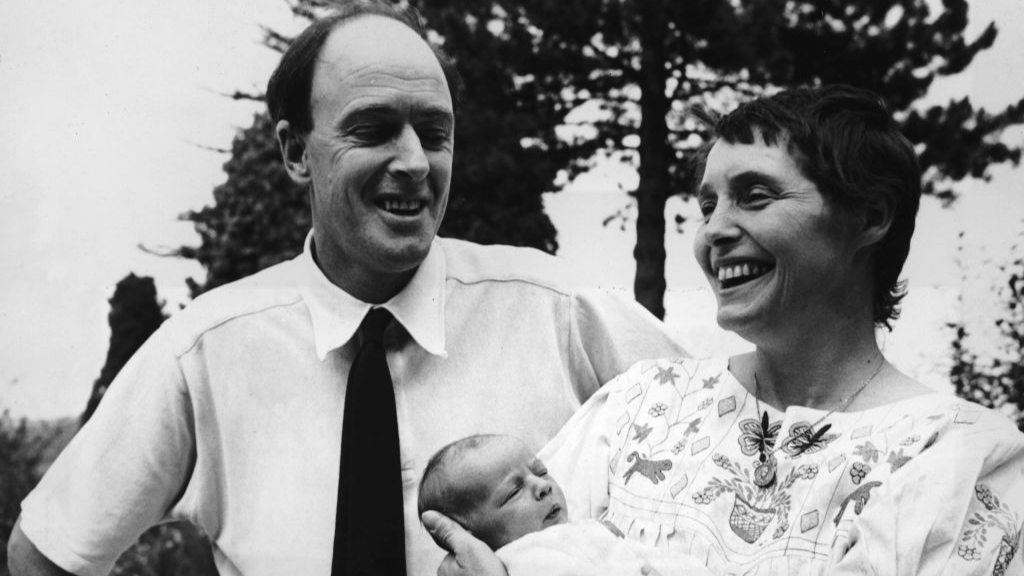 Welsh-born author Roald Dahl (1916 - 1990) smiles with his wife, American actor Patricia Neal and their newborn daughter Lucy