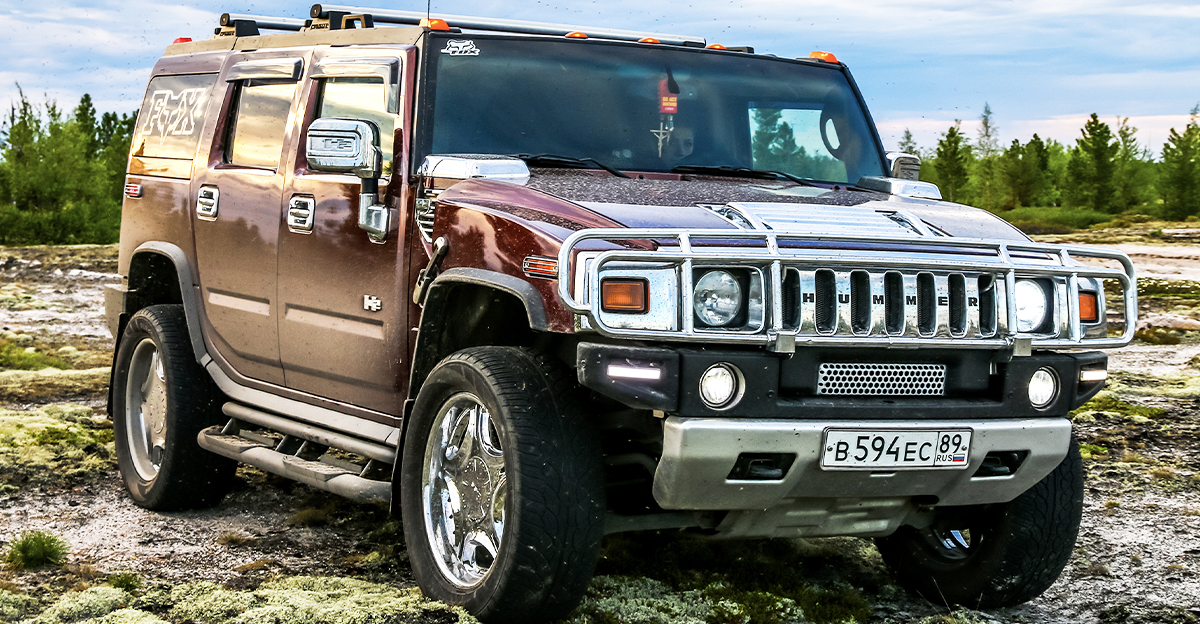 A Hummer H2 off-road in the countryside.