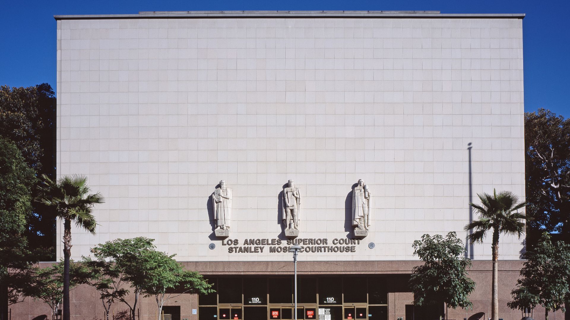 The Stanley Mosk Courthouse  — the Grand Avenue entrance facade with bas-relief statues, in the Civic Center, Downtown Los Angeles, California.
Renowned architect Paul R. Williams lead the Late Moderne style building's design team, that was completed in 1