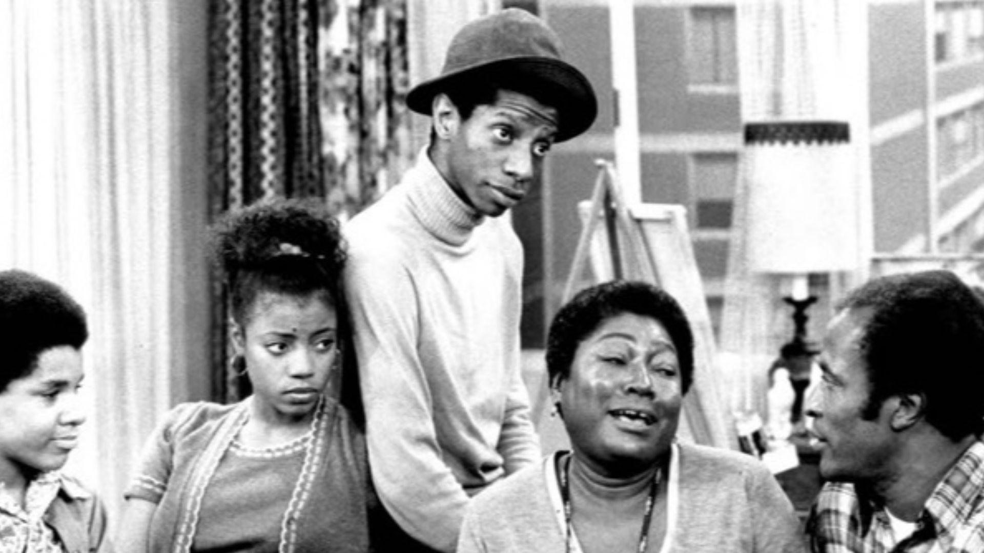 Photo of the Evans family from the television program Good Times.  From left: Ralph Carter (Michael), BernNadette Stanis (Thelma), Jimmie Walker (J.J.), Esther Rolle (Florida), John Amos (James).