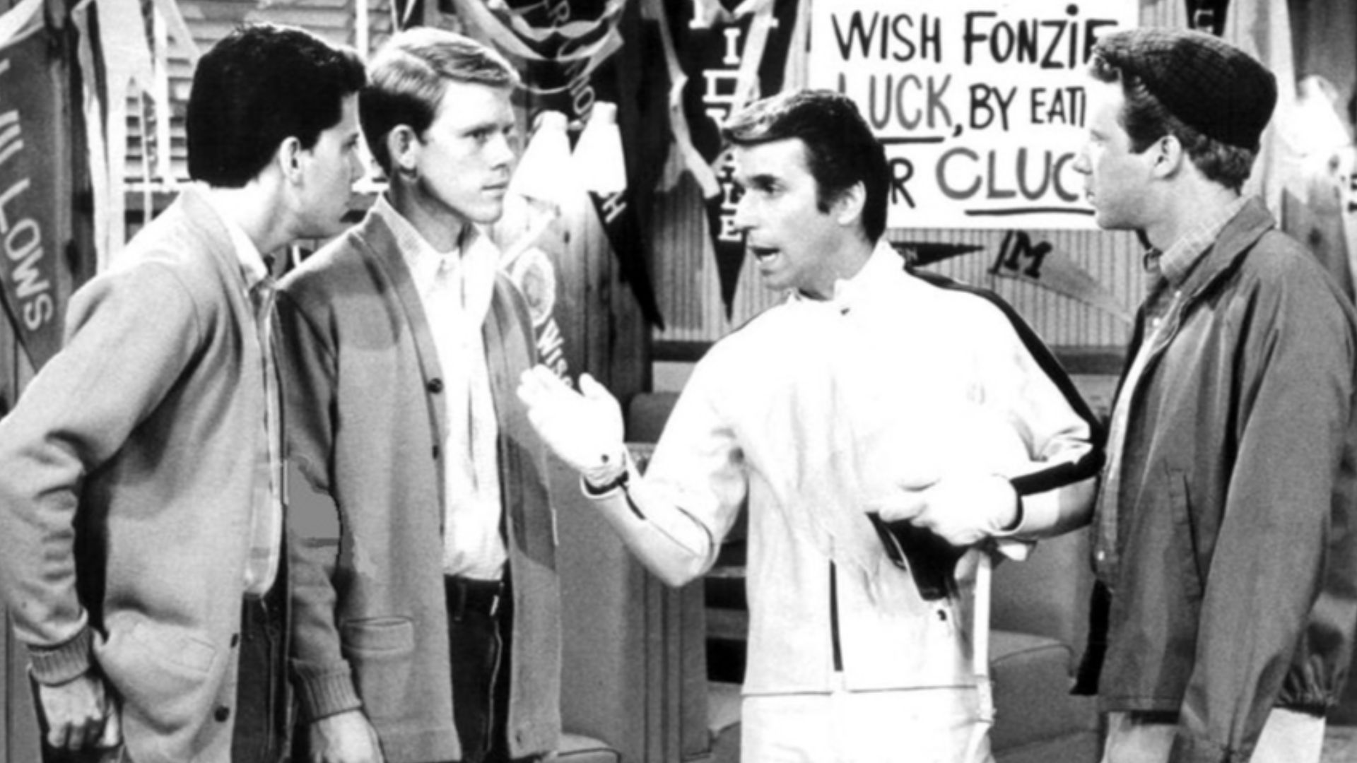 Publicity photo from Happy Days. Pictured are Potsie (Anson Williams), Richie (Ron Howard), Fonzie (Henry Winkler) and Ralph Malph (Donny Most) at Arnold's drvie-in. The episode deals with Fonzie's attempt to set a record by leaping over 14 garbage cans w