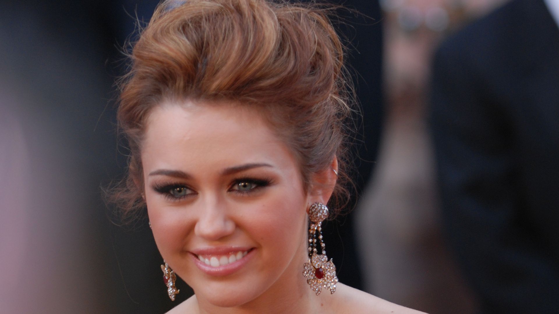 While other teens her age are planning for prom, Miley Cyrus is courted by a sea of photographers at the 82nd Academy Awards March 7, 2010 in Hollywood.