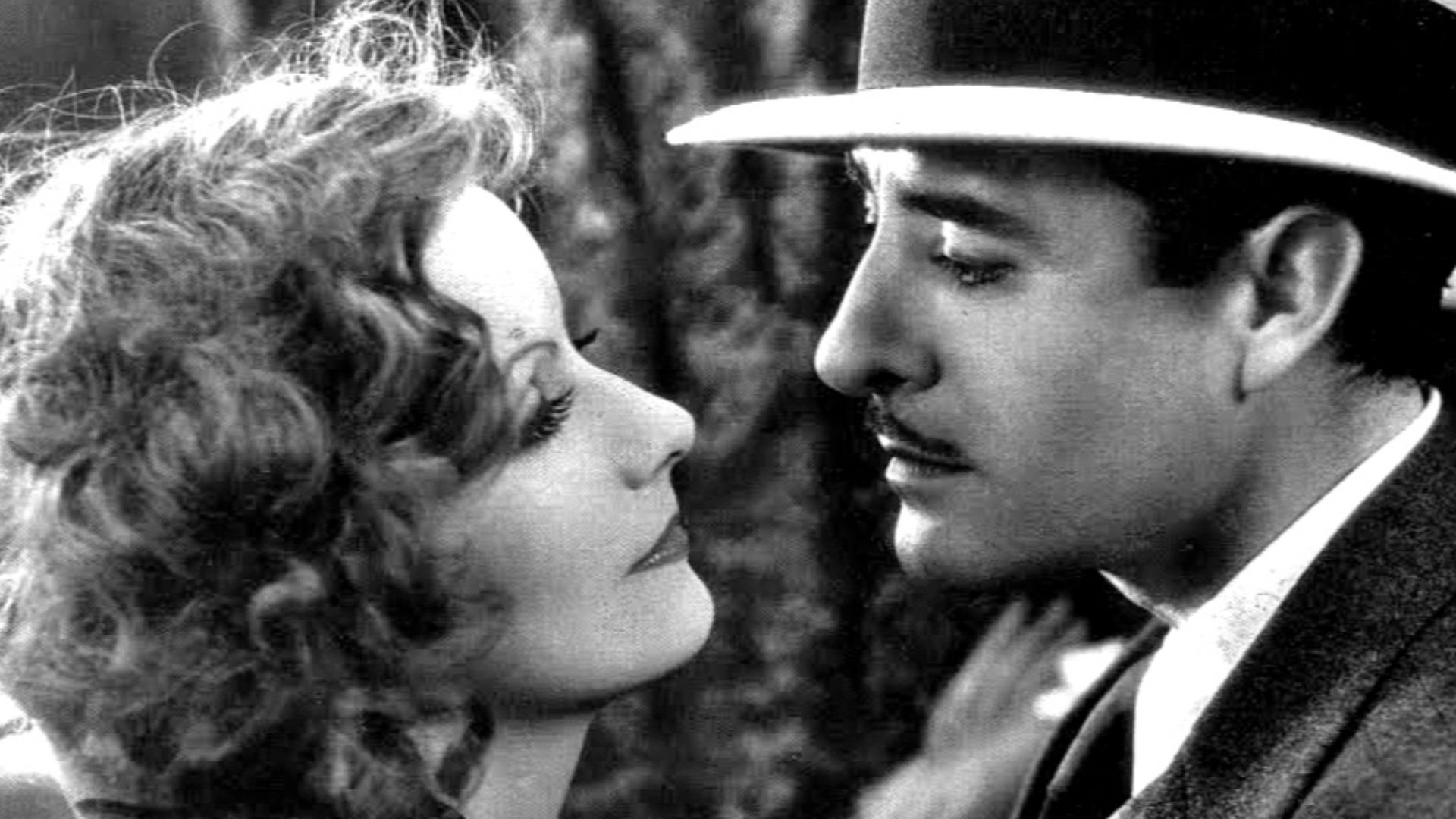 Studio publicity photo for film A Woman of Affairs, showing Greta Garbo and John Gilbert. No copyright given. See also: film still article.
