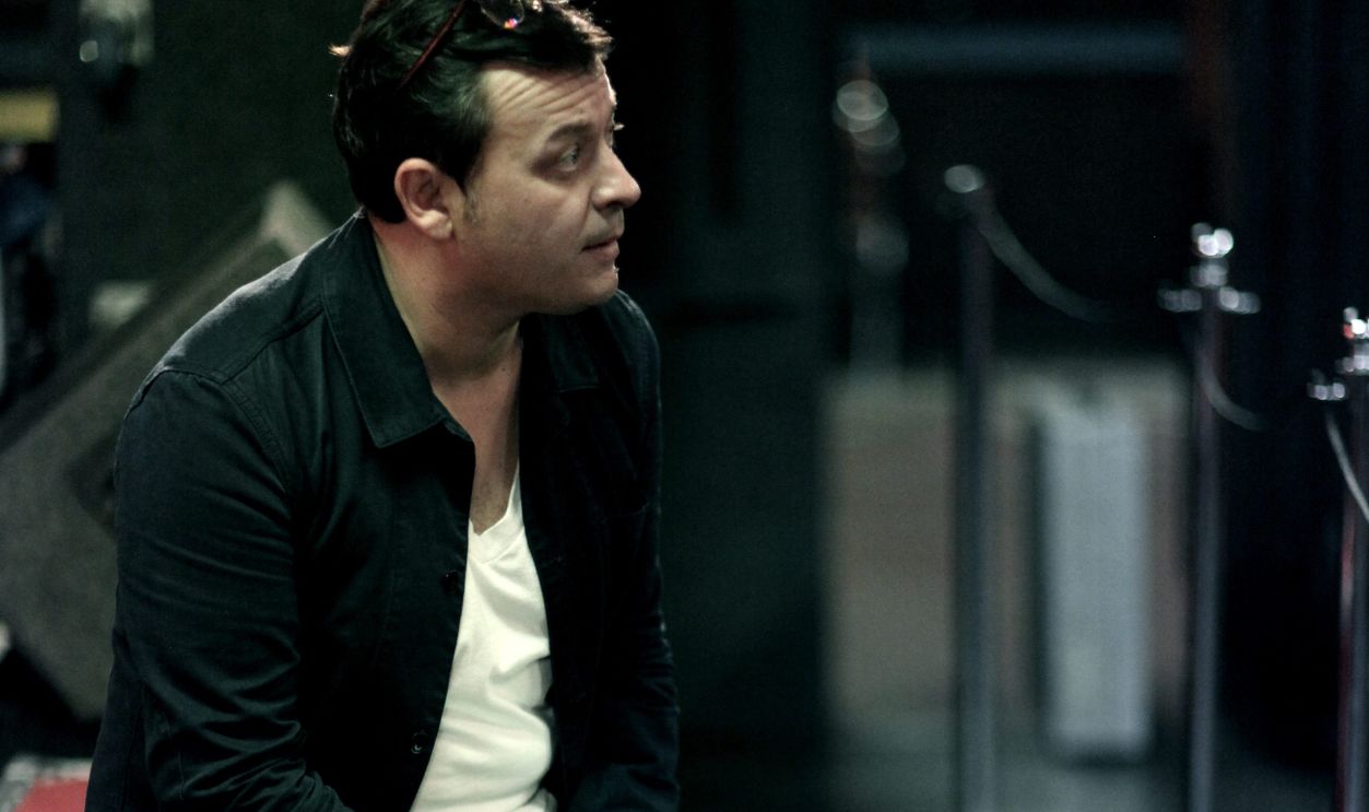 LONDON, UNITED KINGDOM - SEPTEMBER 10: James Dean Bradfield of the Manic Street Preachers sits on a flight case before the band perform at the 100 Club, London on 10th September 2013 .