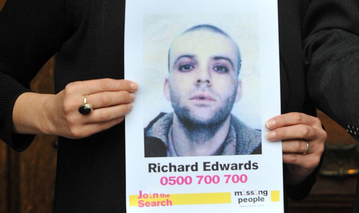 Rachel Elias, sister of missing Manic Street Preachers guitarist Richey Edwards, holds up posters of her missing loved one outside the Houses of Parliament, London, ahead of her giving evidence at the UK's first Parliamentary Inquiry into the rights of families of missing people. 