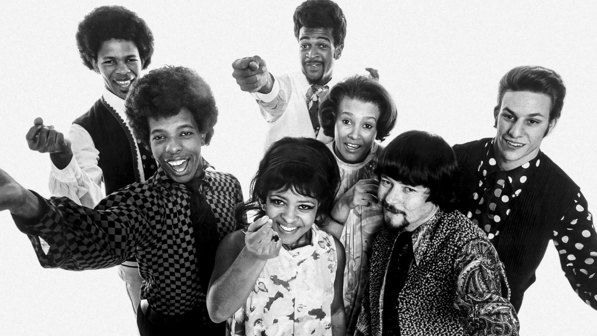 Publicity photo of the American band Sly and the Family Stone in 1968. From left to right: Freddie Stone, Sly Stone, Rose Stone, Larry Graham, Cynthia Robinson, Jerry Martini, Greg Errico.