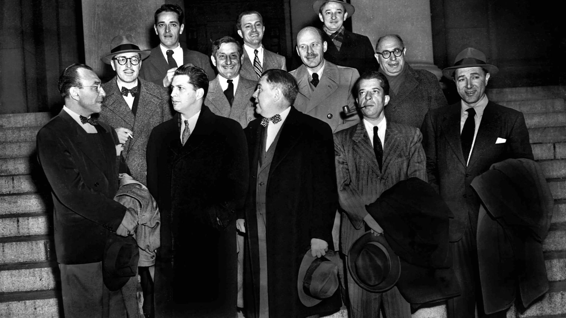 Ten Hollywood personalities, the “Hollywood 10,” stand with their attorneys outside district court in Washington, D.C., Jan. 9, 1948 before arraignment on contempt of Congress charges. From left, front: Herbert Biberman, Attorney Martin Popper, Attorney R