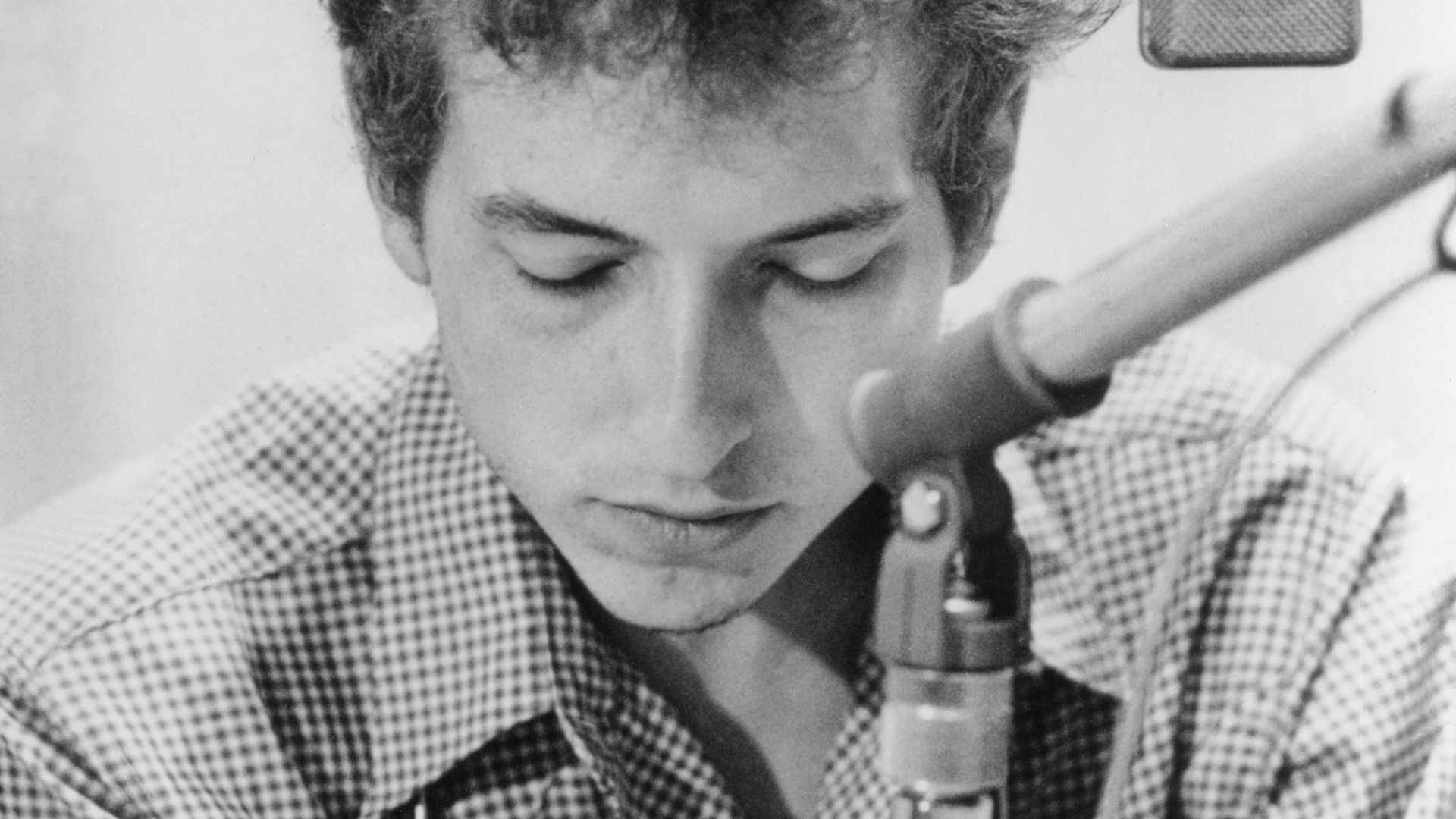 Bob Dylan, 1963 promo photo by Don Hunstein for The Times They Are a-Changin' in a recording studio.