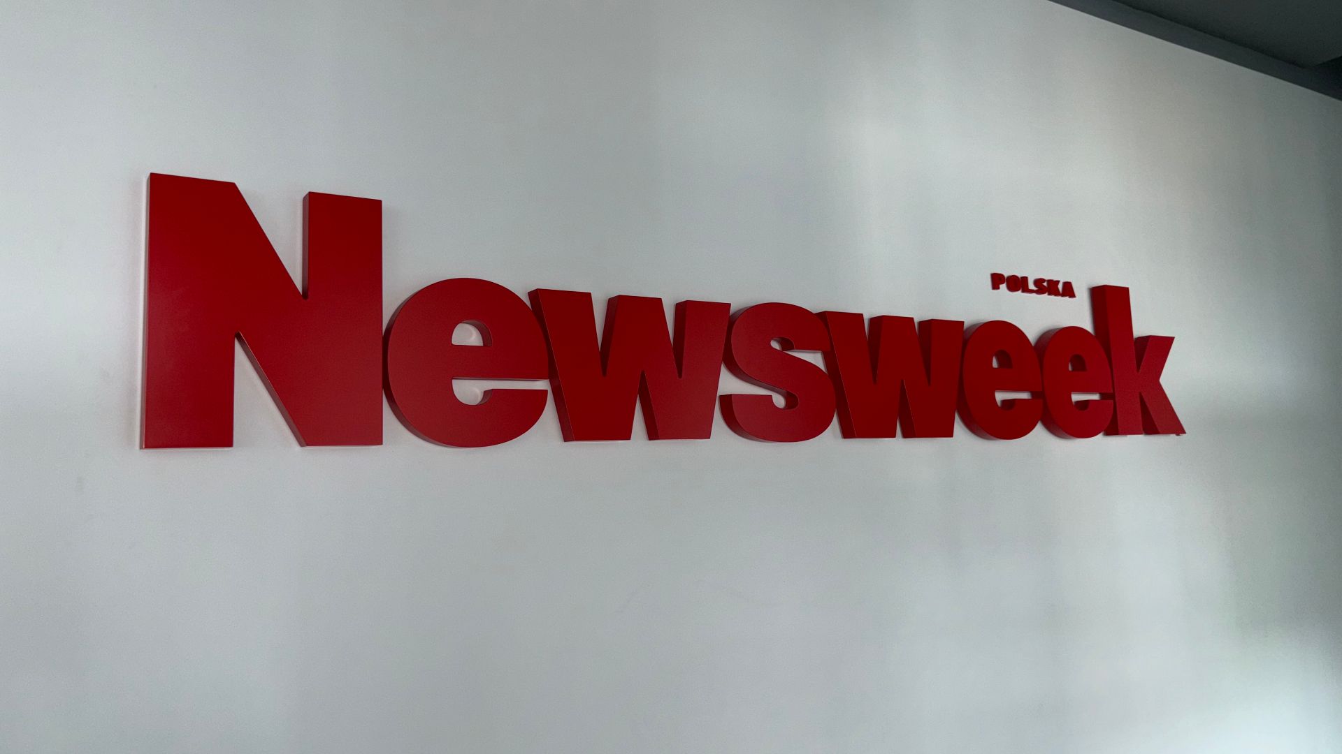 Newsweek Polska logo in office.