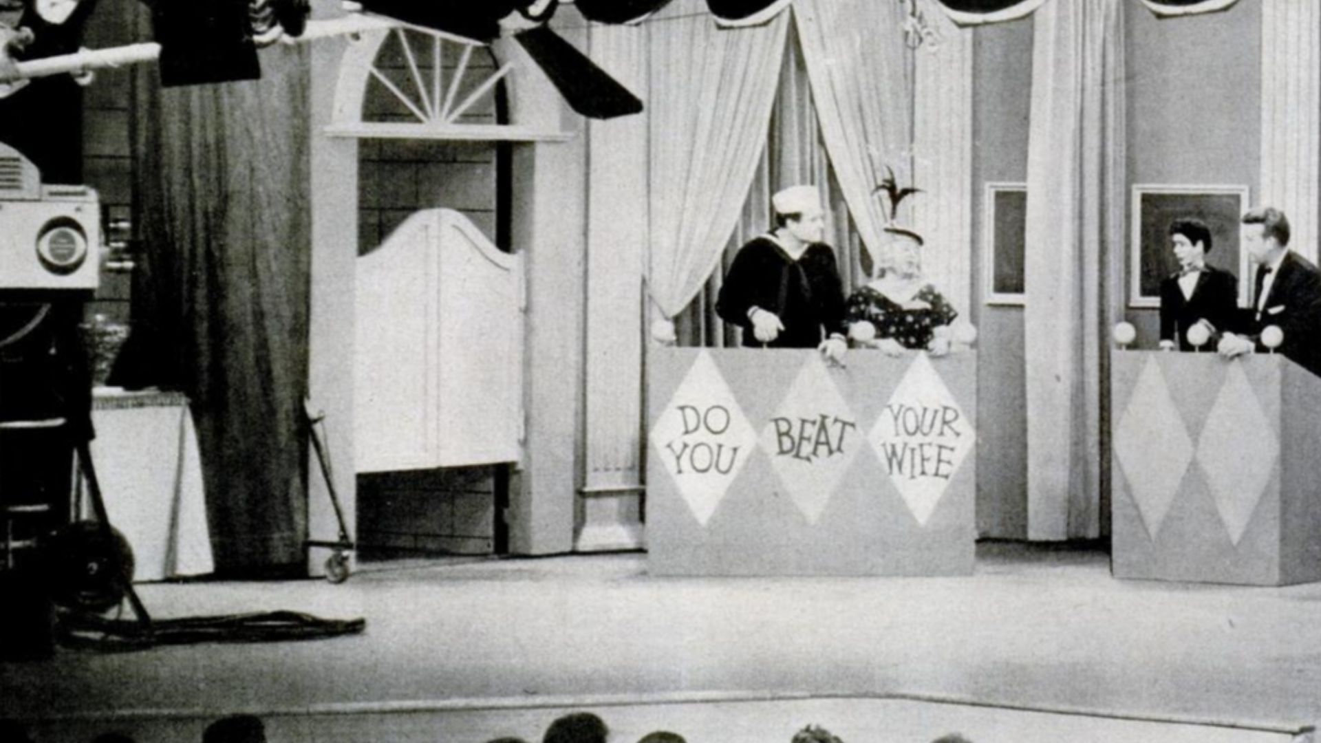 Dress rehearsal of The Red Skelton Show depicting Red Skelton and Mickey Rooney from two-page Montsanto ad in Life magazine. The sketch appears to be a parody of the CBS game show Do You Trust Your Wife?