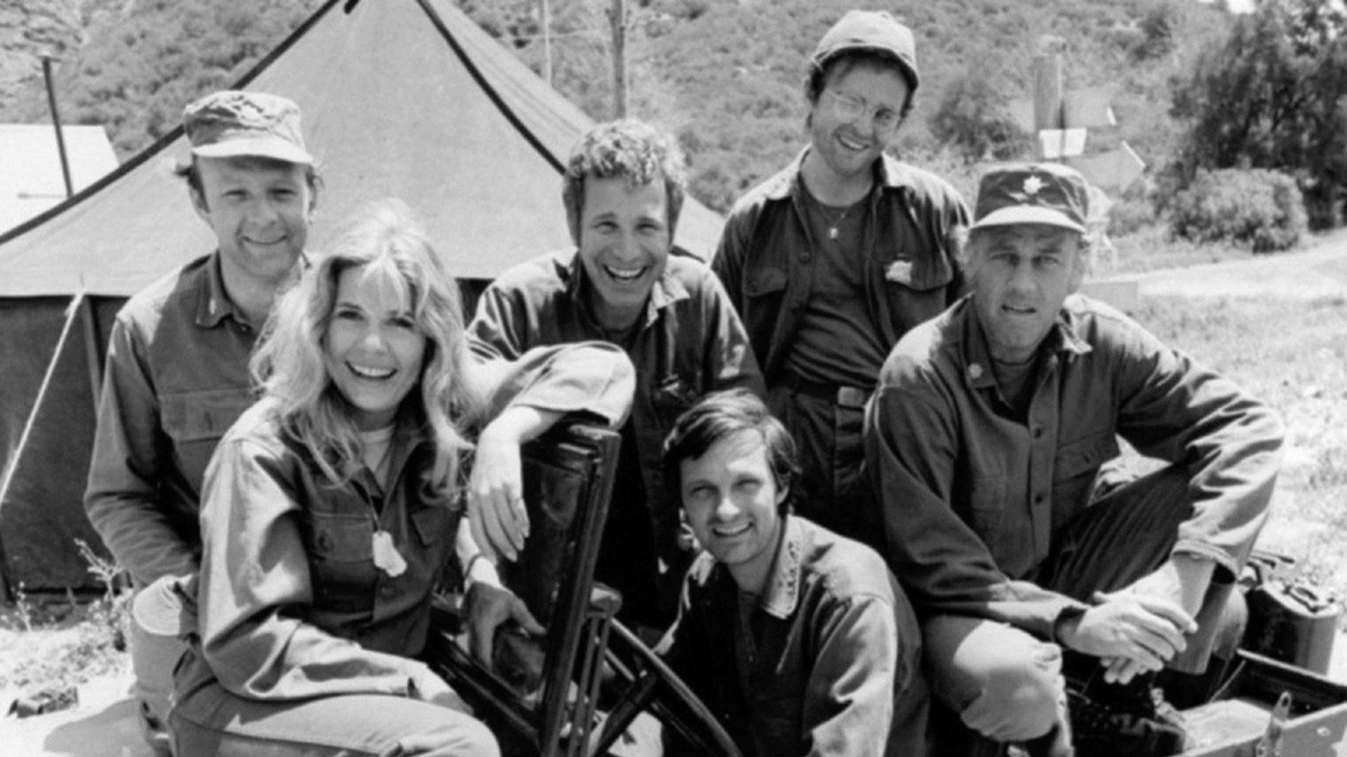 Publicity photo from the M*A*S*H season premiere, 1974. Pictured are: Loretta Swit, Larry Linville, Wayne Rogers, Gary Burghoff, Alan Alda (driver of jeep), and McLean Stevenson.