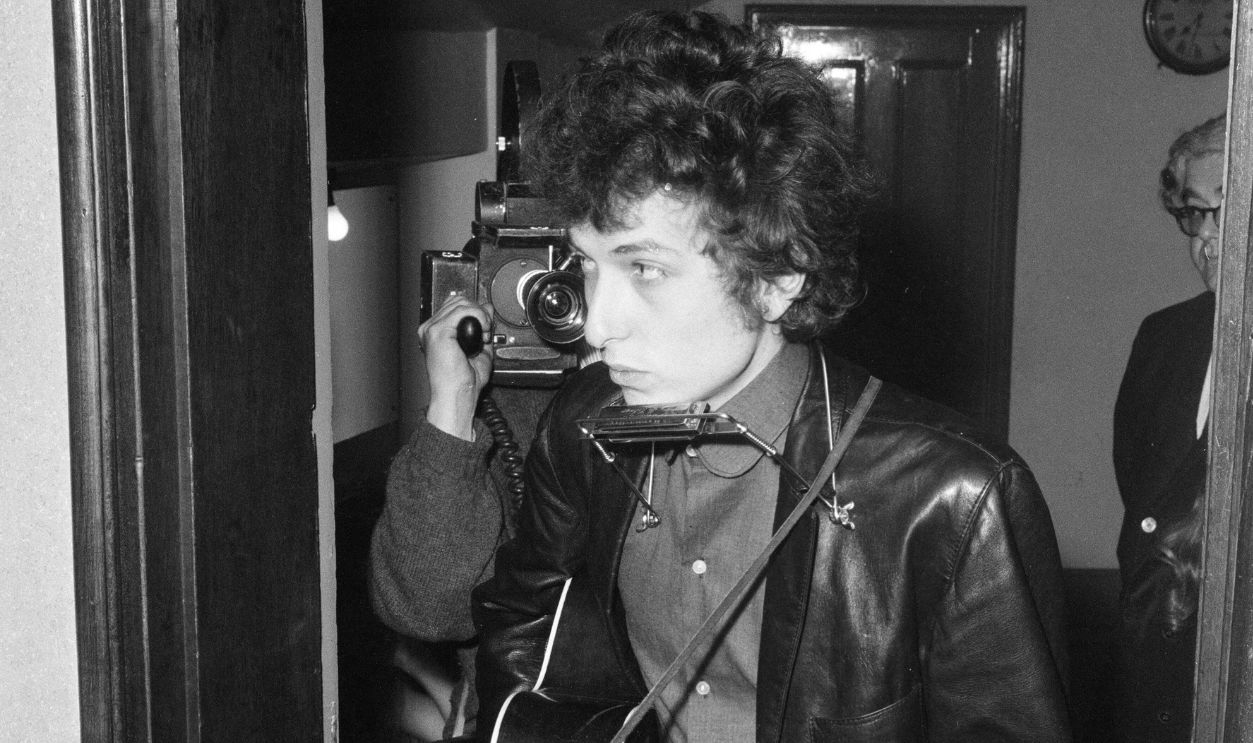 American folk singer Bob Dylan in concert at the Royal Albert Hall, London during his European Tour. 9th May 1965.