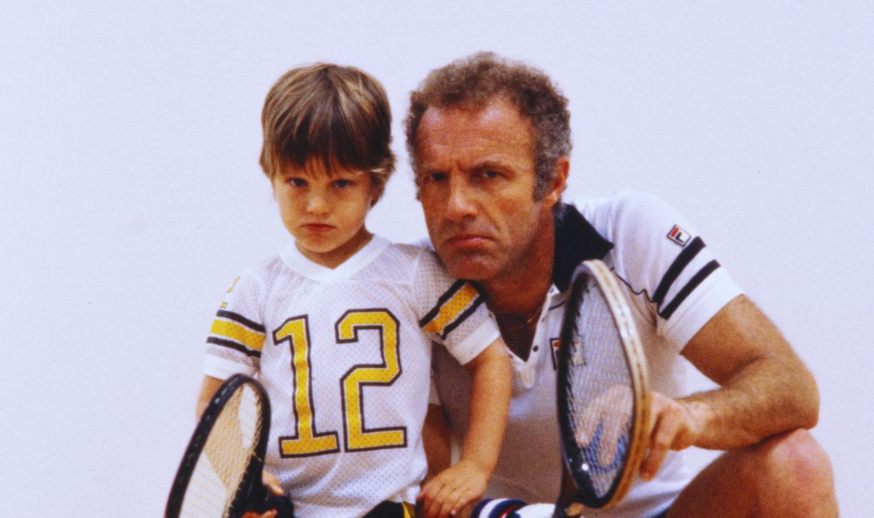 Portrait of actor James Caan and his son Scott Caan making funny faces in a squash court in Miami, April 1981.