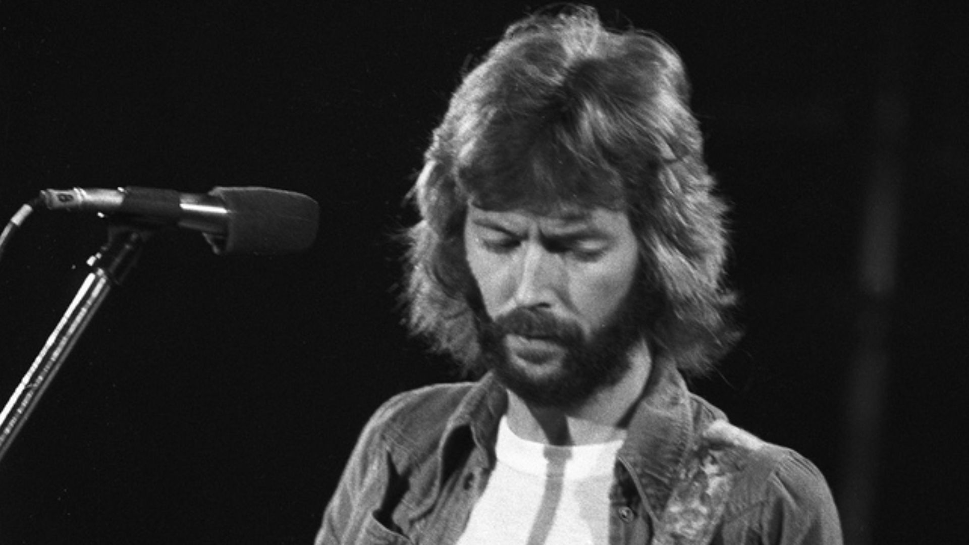 Eric Clapton - Swing Auditorium, San Bernardino, CA, There's One In Every Crowd Tour.
Aug. 15, 1975, Monochrome Frame 17.
Reduction of Tri-X Negative scan at 4000dpi. Shot with an Asahi Pentax w/200mm telephoto.

He's playing Blackie.
