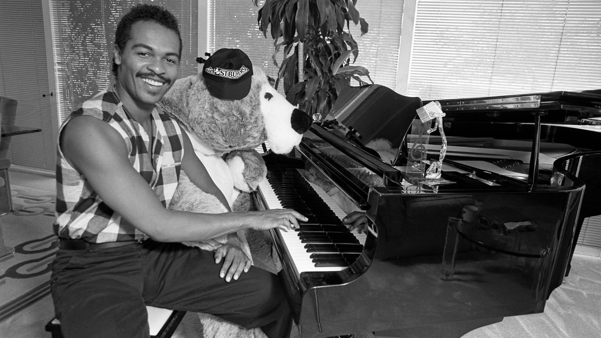 Ray Parker Jr., at the piano with stuffed friend Ralph, on Ghostbusters: