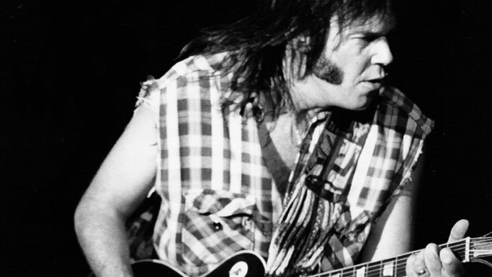 Neil Young performing with Crazy Horse in Barcelona