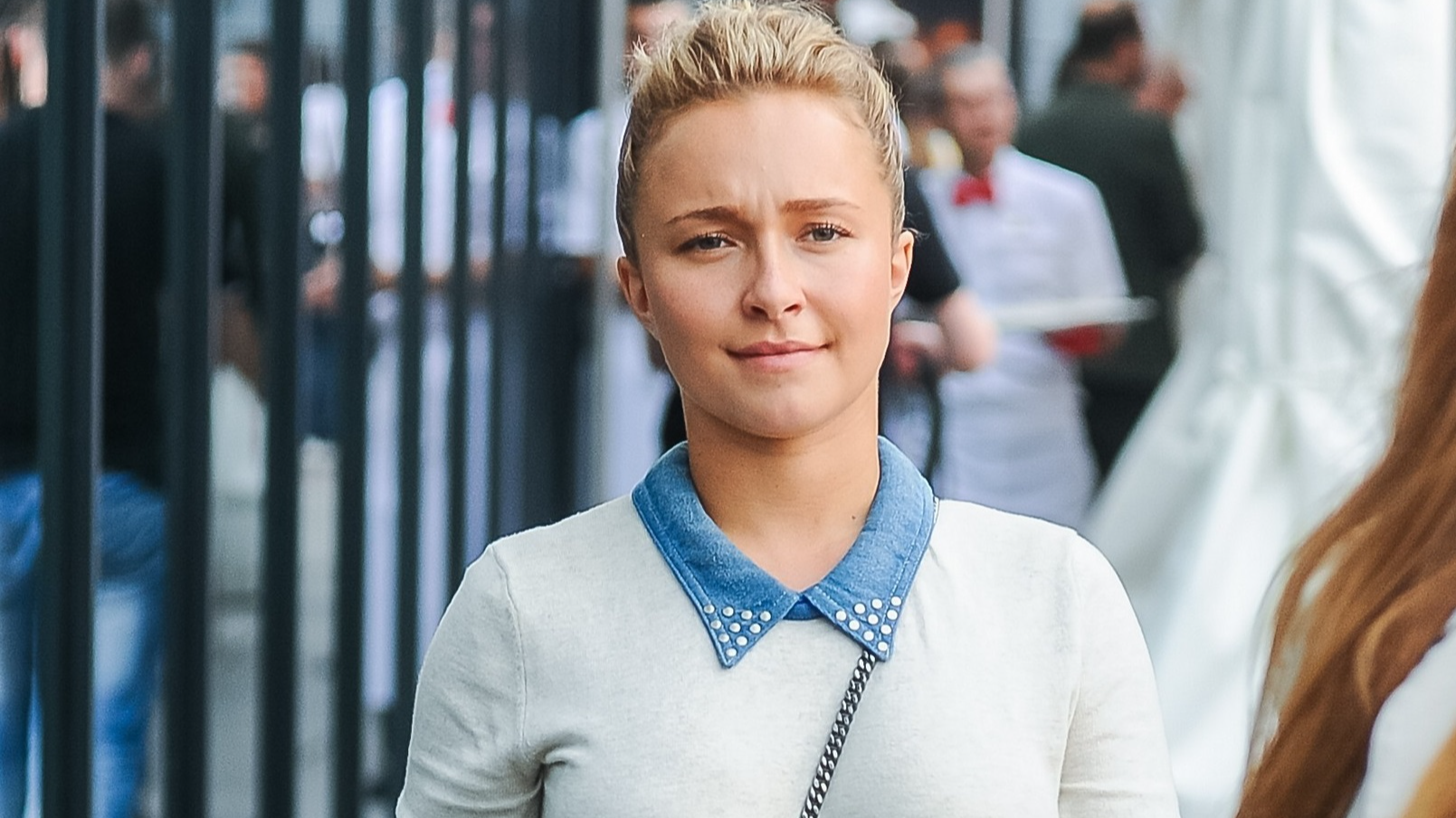 Hayden Panettiere wearing blue shirt and grey sweater walking on the street - 2014