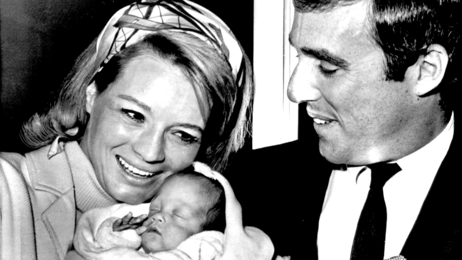 Candid photo of Angie Dickinson and husband-composer Burt Bacharach with their new baby.