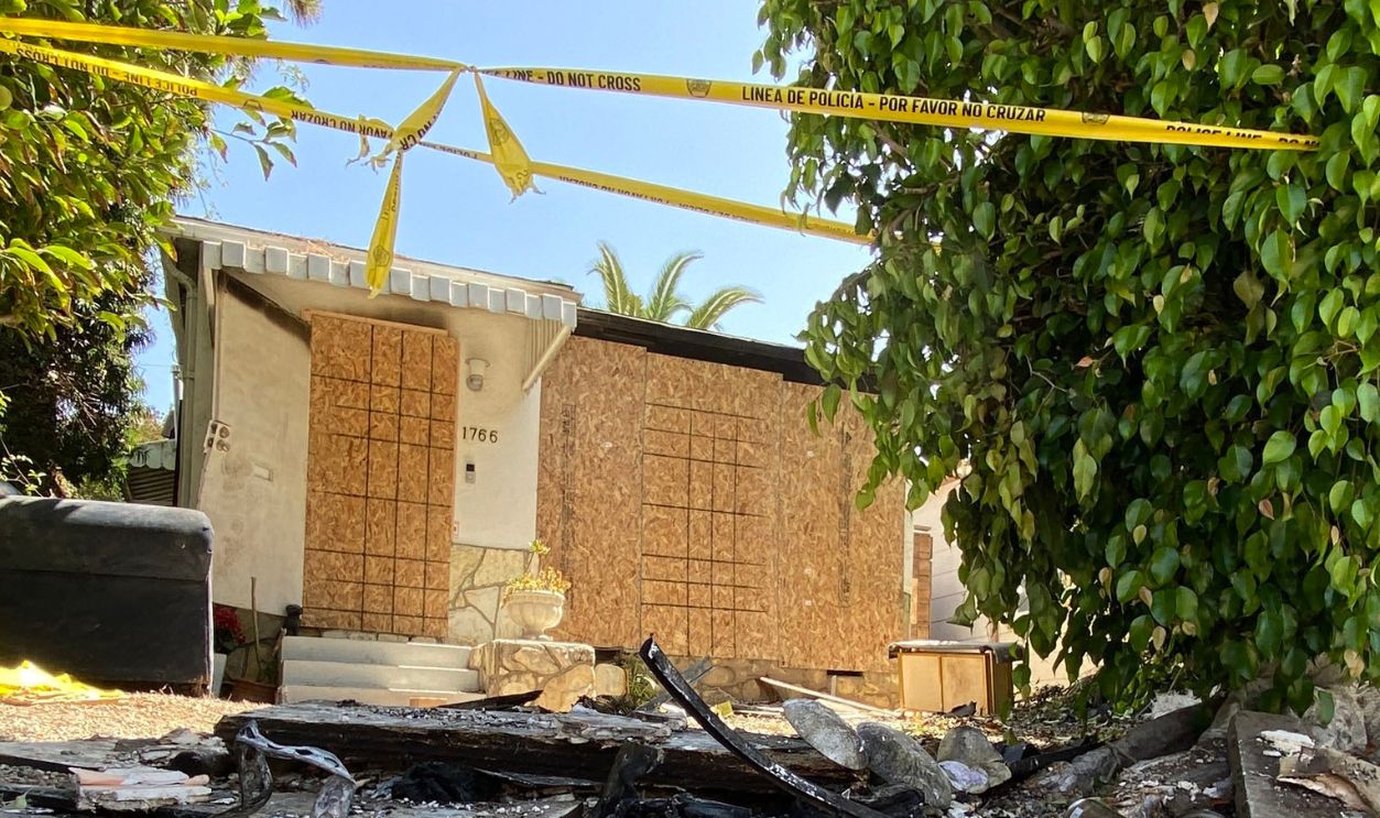 Getty Images - 1242391639 - Charred debris and caution tape are seen at the site where US actress Anne Heche crashed into a home in Mar Vista, California on August 8, 2022. - US actress Anne Heche has been hospitalized in critical condition after crashing her car into a Los Angeles home, US media reported on August 5, 2022. The 53-year-old actress initially crashed into an apartment building garage before driving off, according to images collected by TMZ.