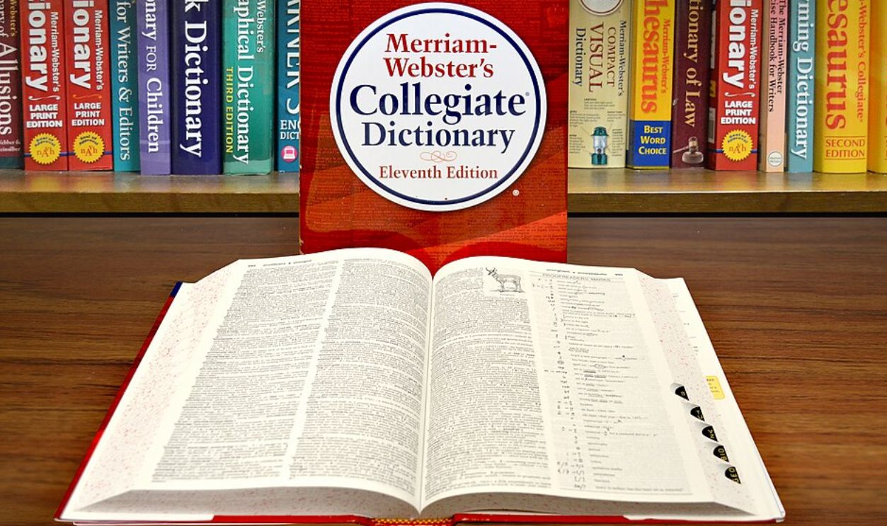 Collegiate Dictionary with open book and bookshelf.