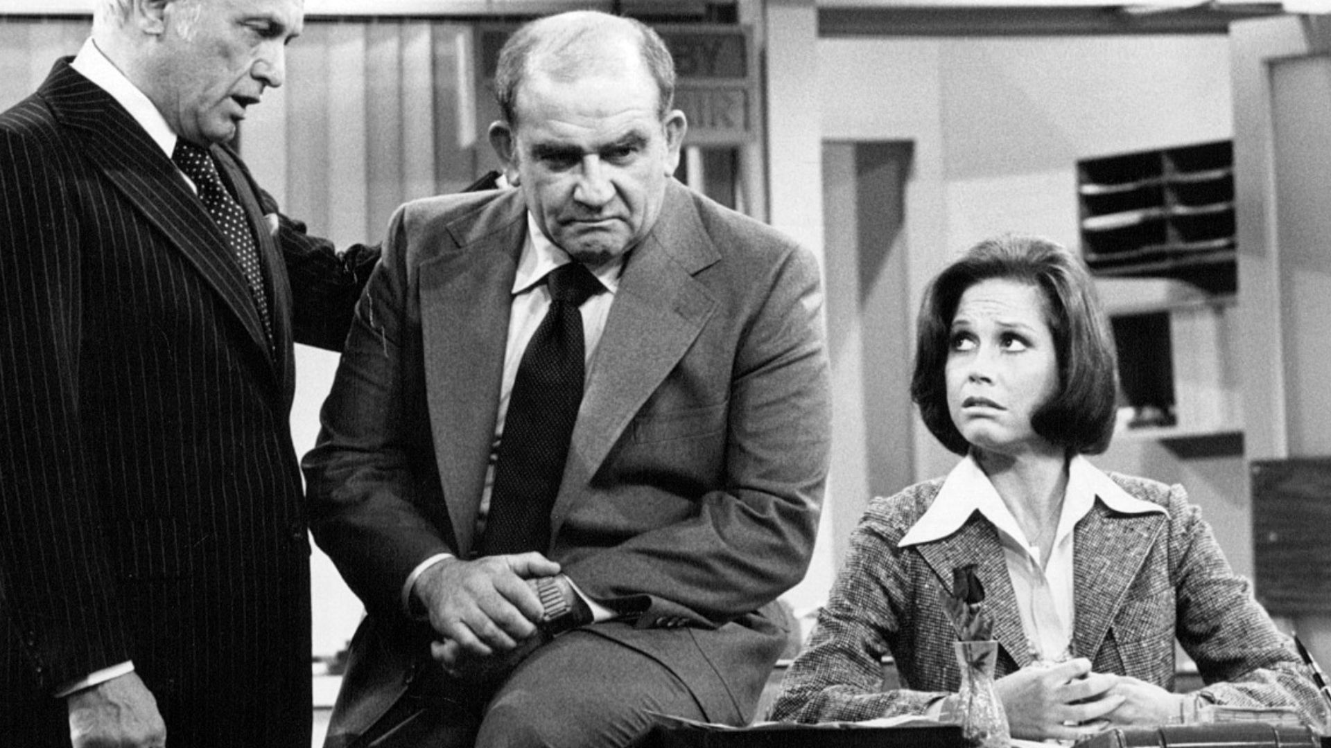 Photo of Ted Knight as Ted Baxter, Ed Asner as Lou Grant and Mary Tyler Moore as Mary Richards from the last episode of The Mary Tyler Moore Show-